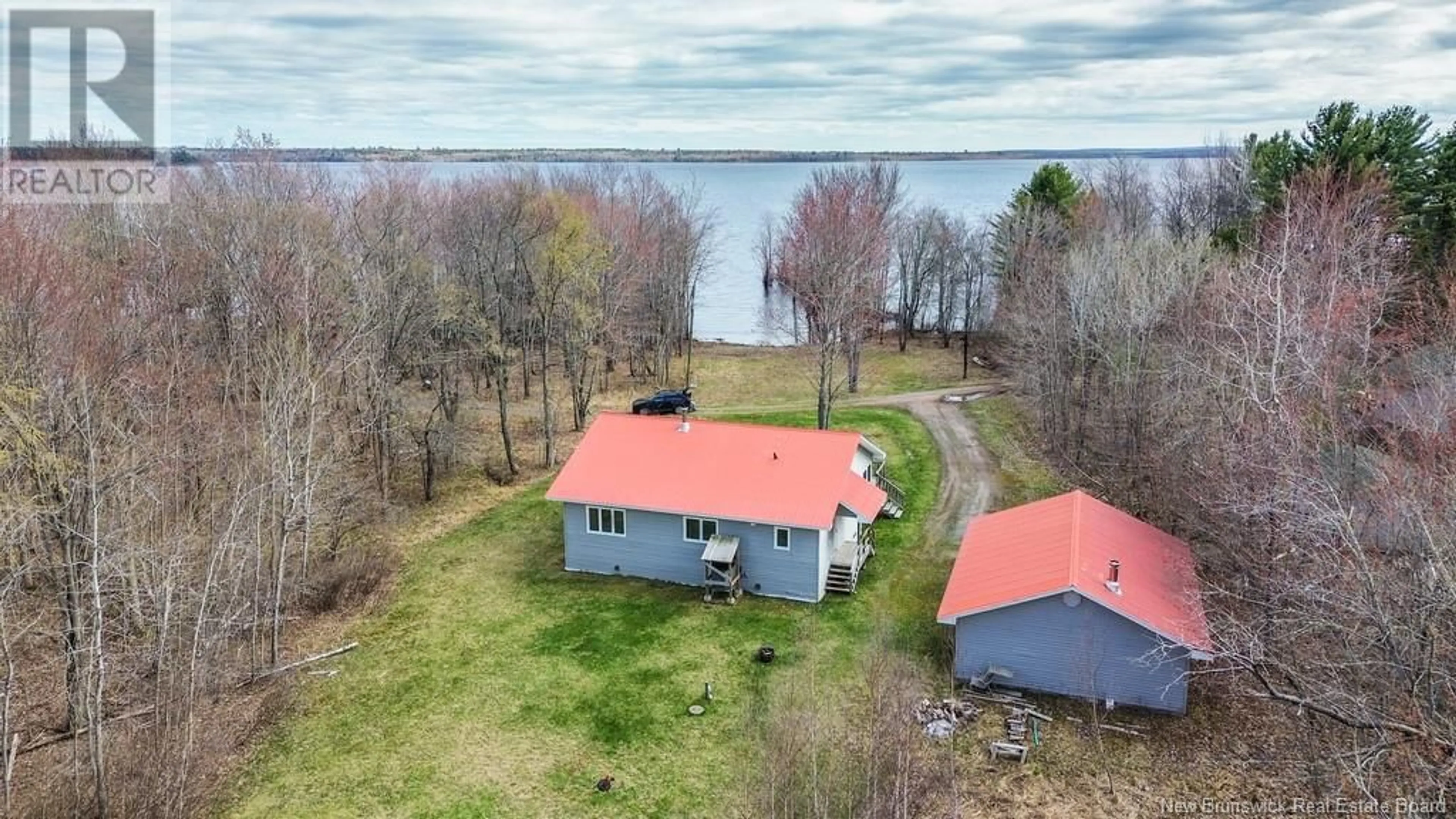 A pic from outside/outdoor area/front of a property/back of a property/a pic from drone, water/lake/river/ocean view for 39 MILLS LANE, Maquapit Lake New Brunswick E4B3Z5
