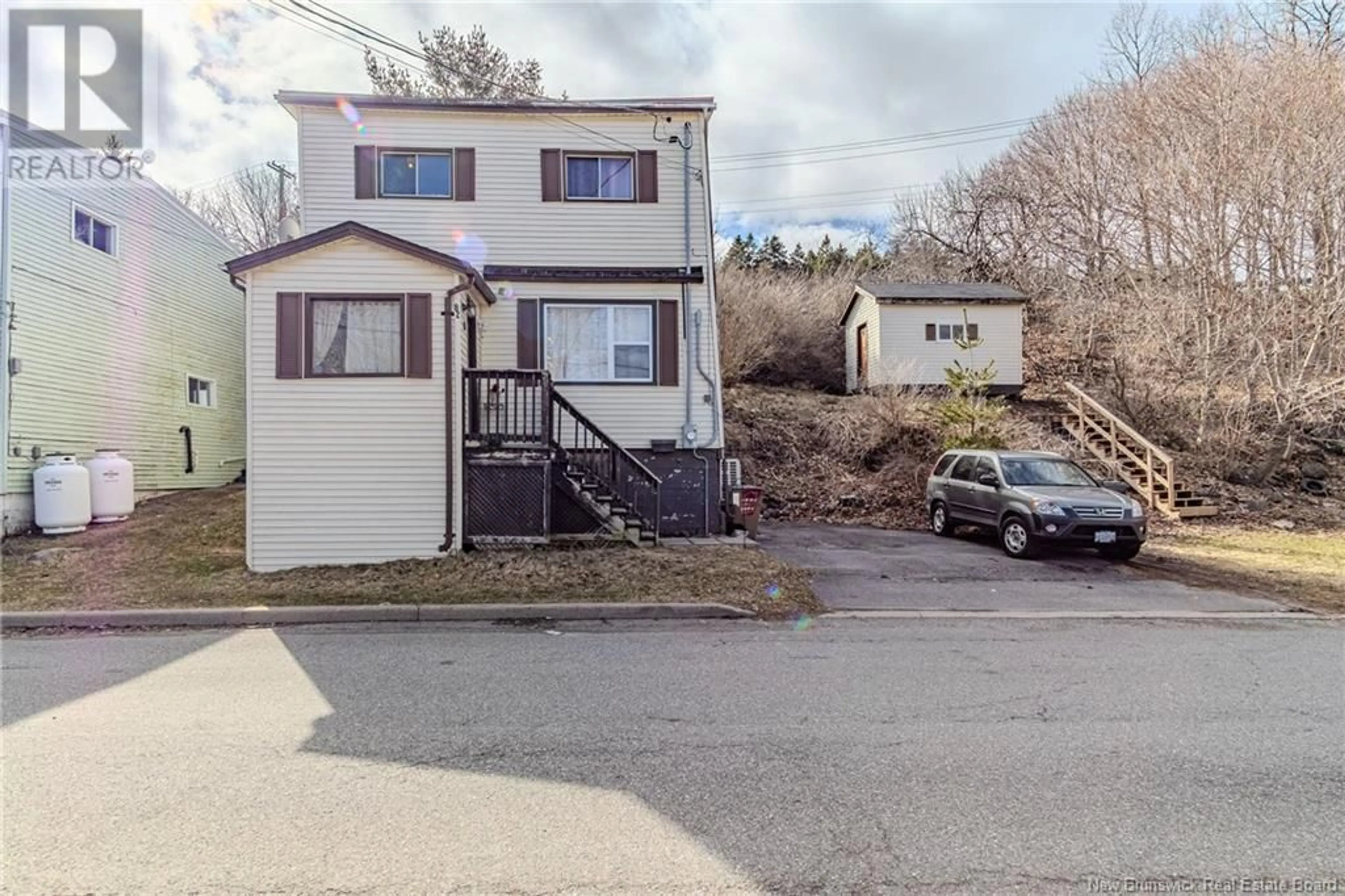 A pic from outside/outdoor area/front of a property/back of a property/a pic from drone, street for 82 SPAR COVE ROAD, Saint John New Brunswick E2K1S1