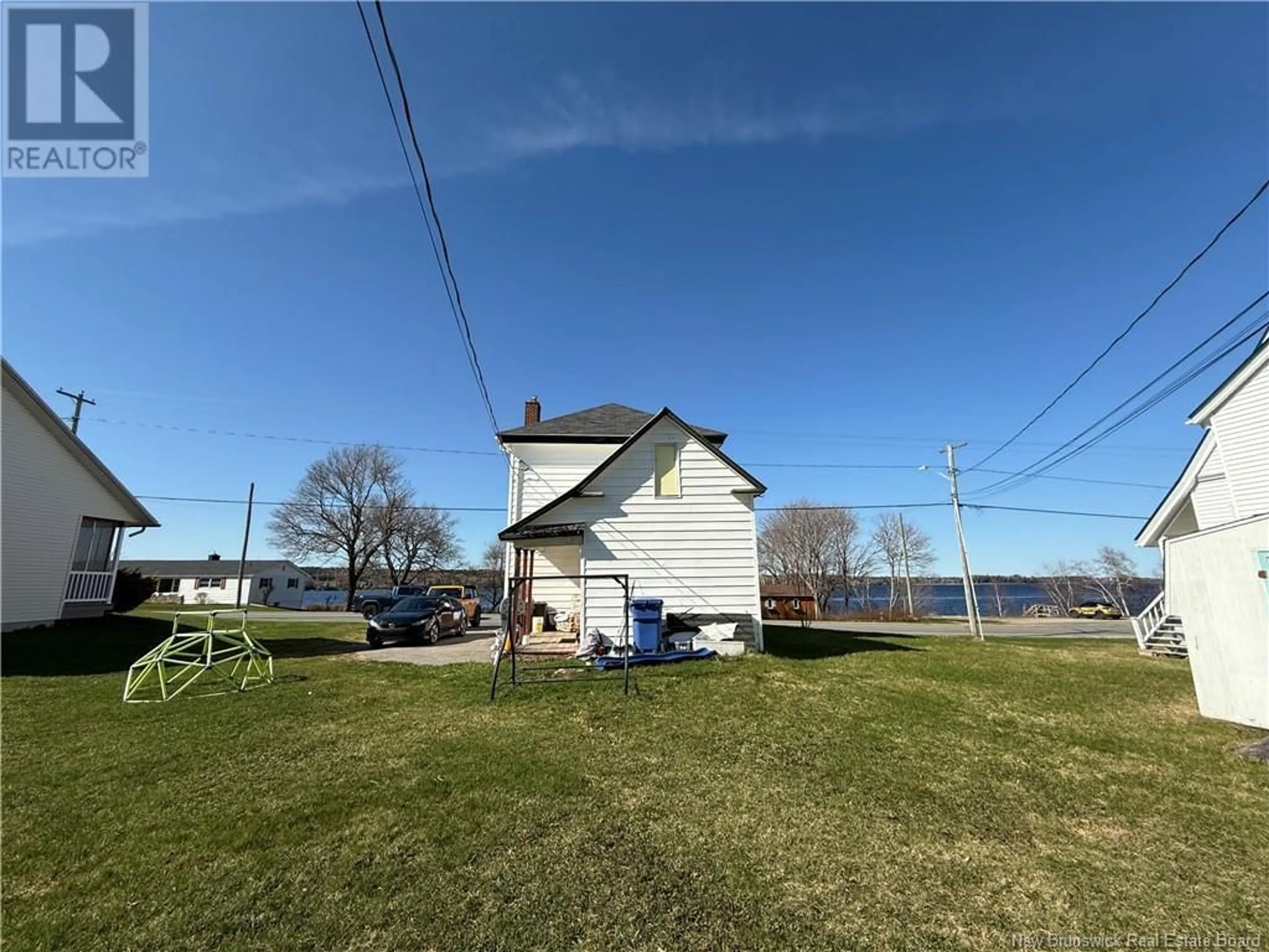 A pic from outside/outdoor area/front of a property/back of a property/a pic from drone, water/lake/river/ocean view for 4388 WATER STREET, Miramichi New Brunswick E1N4L6