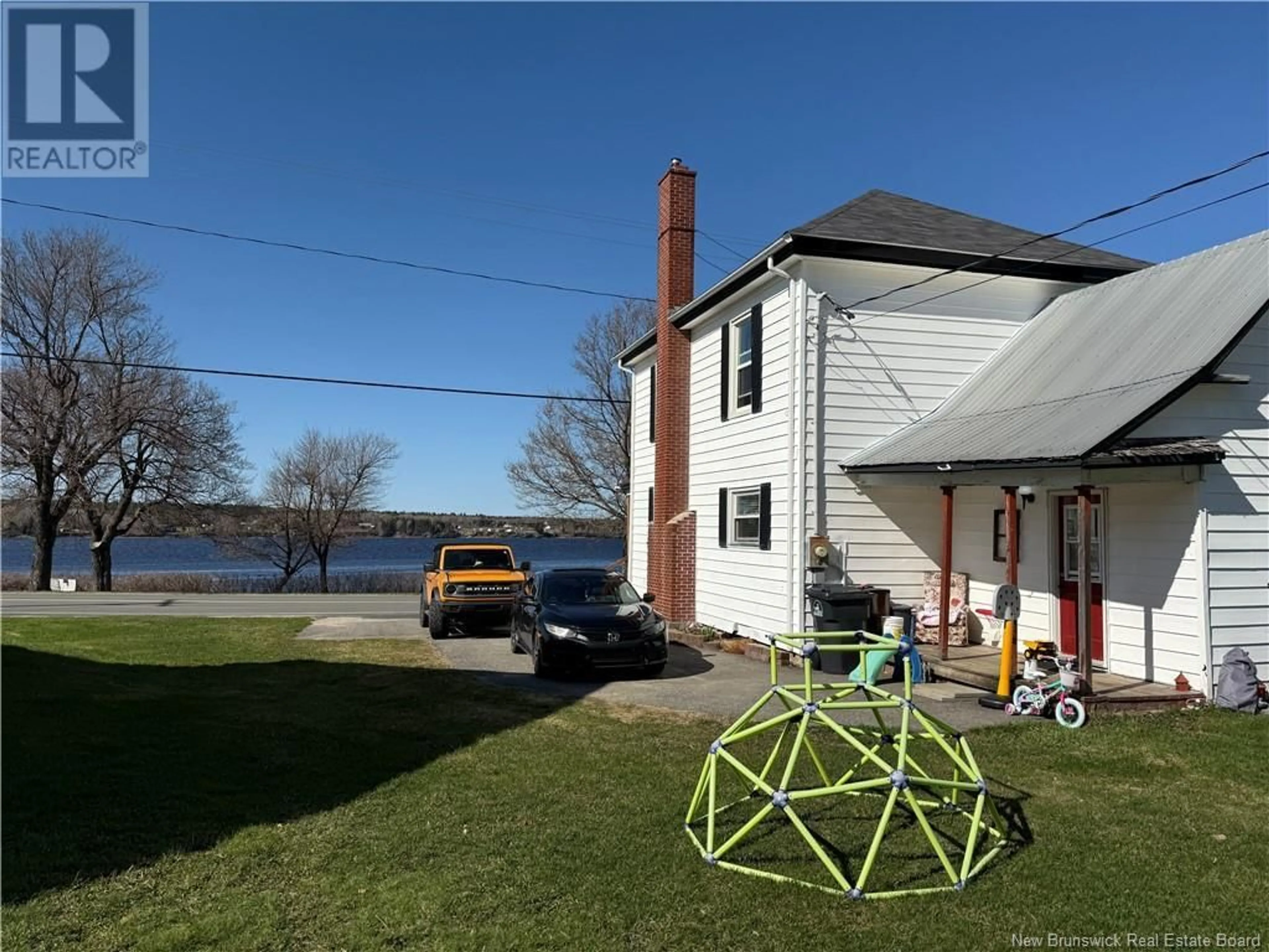 A pic from outside/outdoor area/front of a property/back of a property/a pic from drone, water/lake/river/ocean view for 4388 WATER STREET, Miramichi New Brunswick E1N4L6