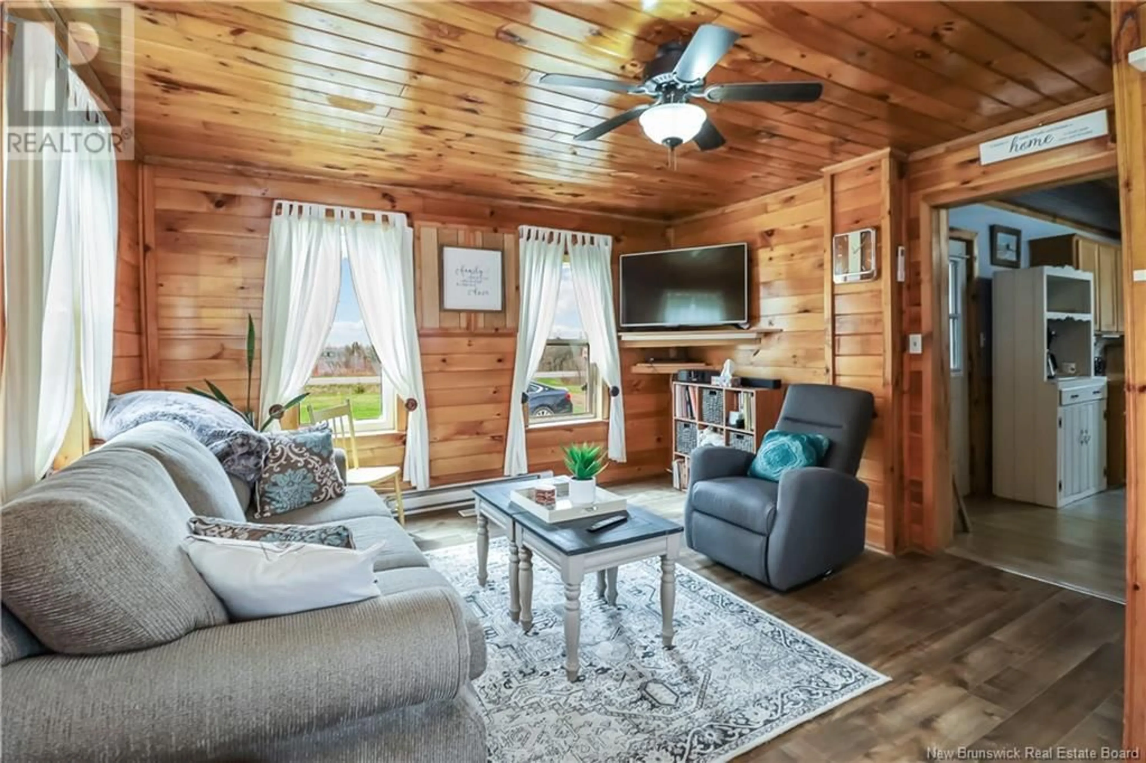 Living room with furniture, wood/laminate floor for 4344 ROUTE 16, Malden New Brunswick E4M2G2