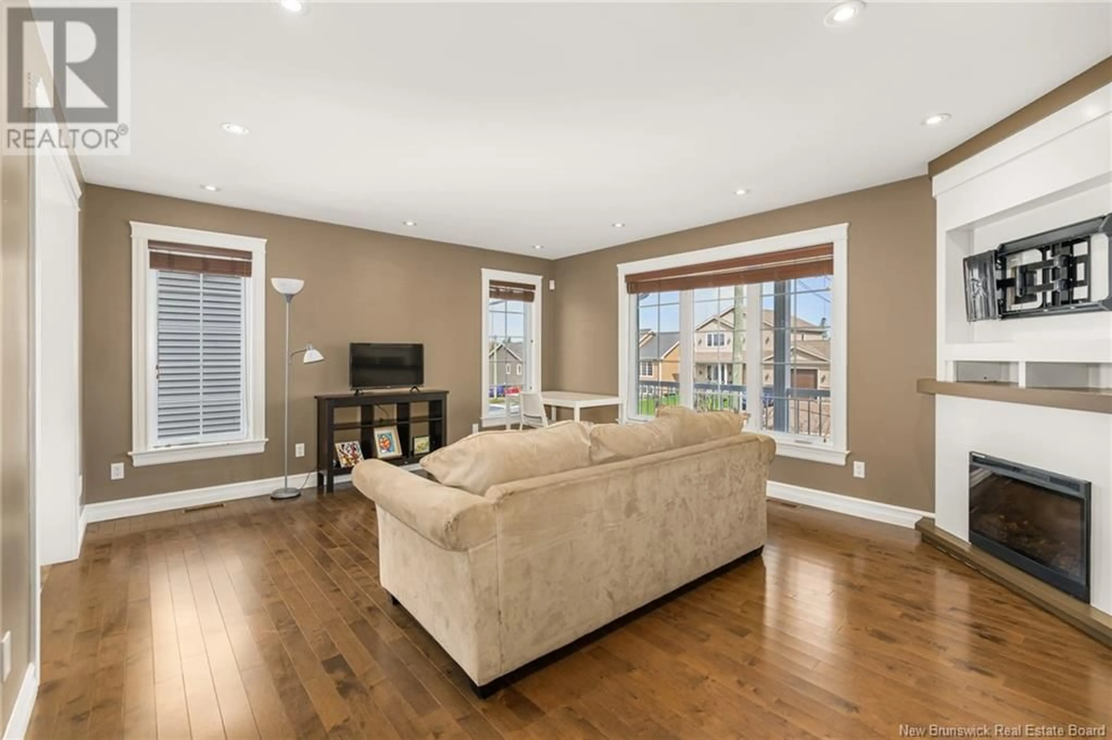 Living room with furniture, wood/laminate floor for 87 TILMON CRESCENT, Dieppe New Brunswick E1A5S3