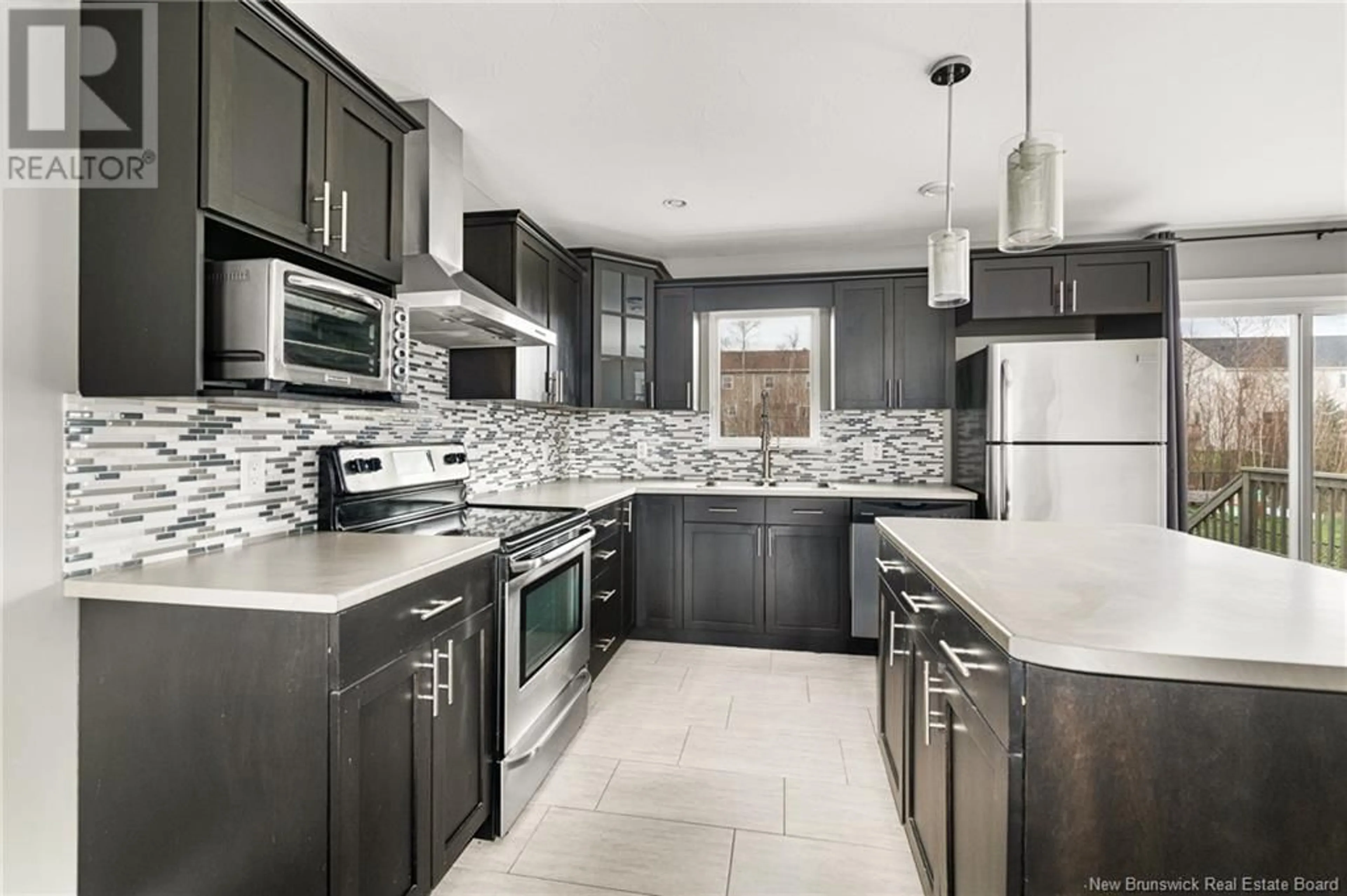 Open concept kitchen, ceramic/tile floor for 83 EDINGTON STREET, Moncton New Brunswick E1E0G5