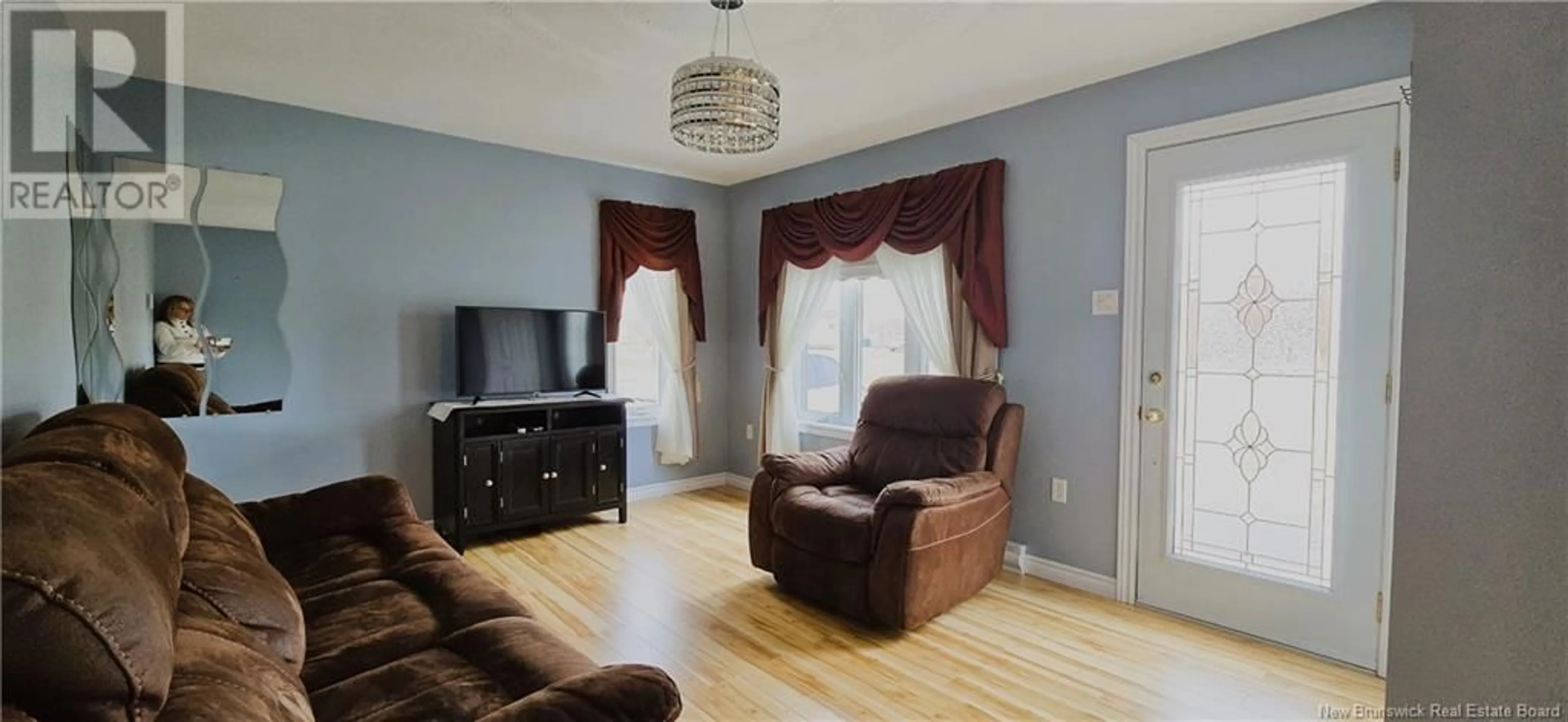 Living room with furniture, wood/laminate floor for 5483 ROUTE 11, Brantville New Brunswick E9H2A8