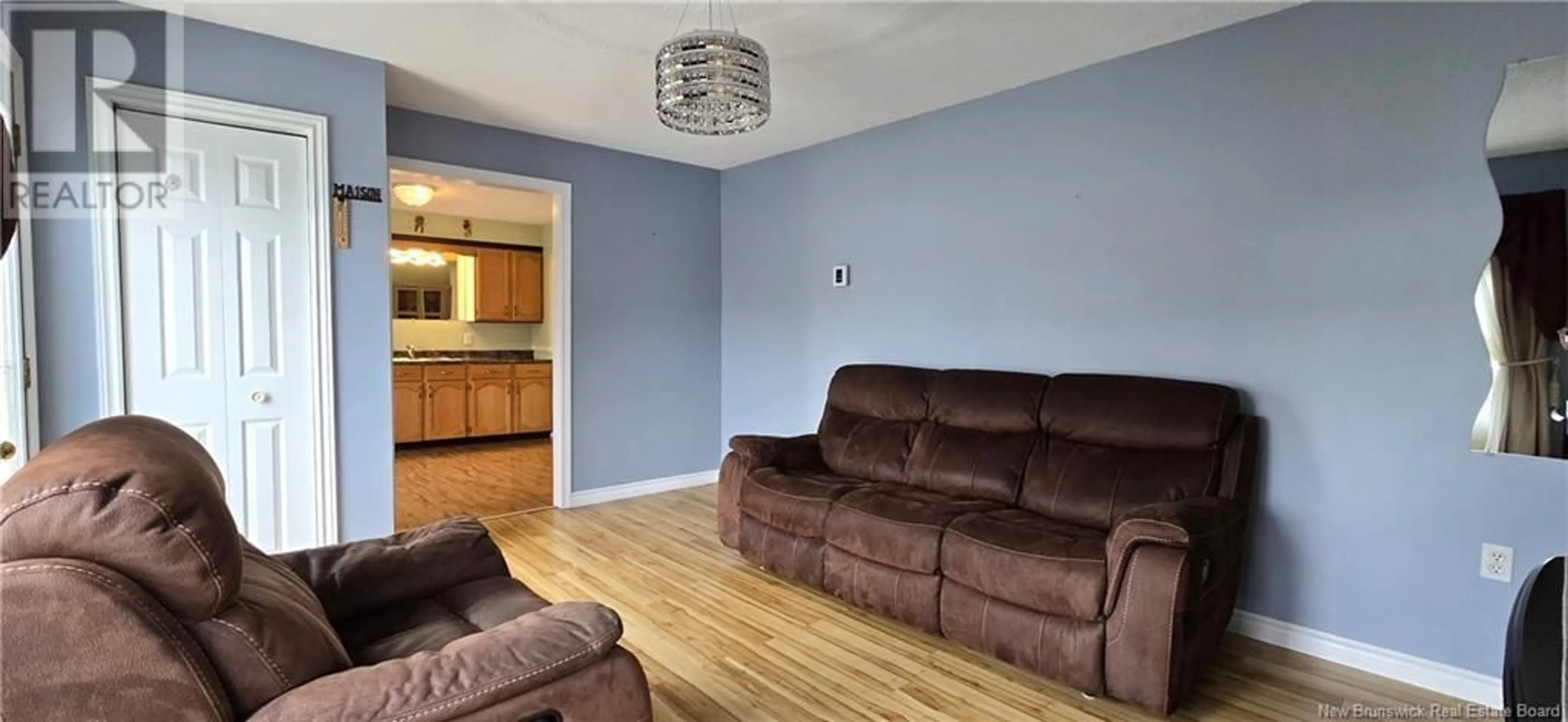Living room with furniture, wood/laminate floor for 5483 ROUTE 11, Brantville New Brunswick E9H2A8