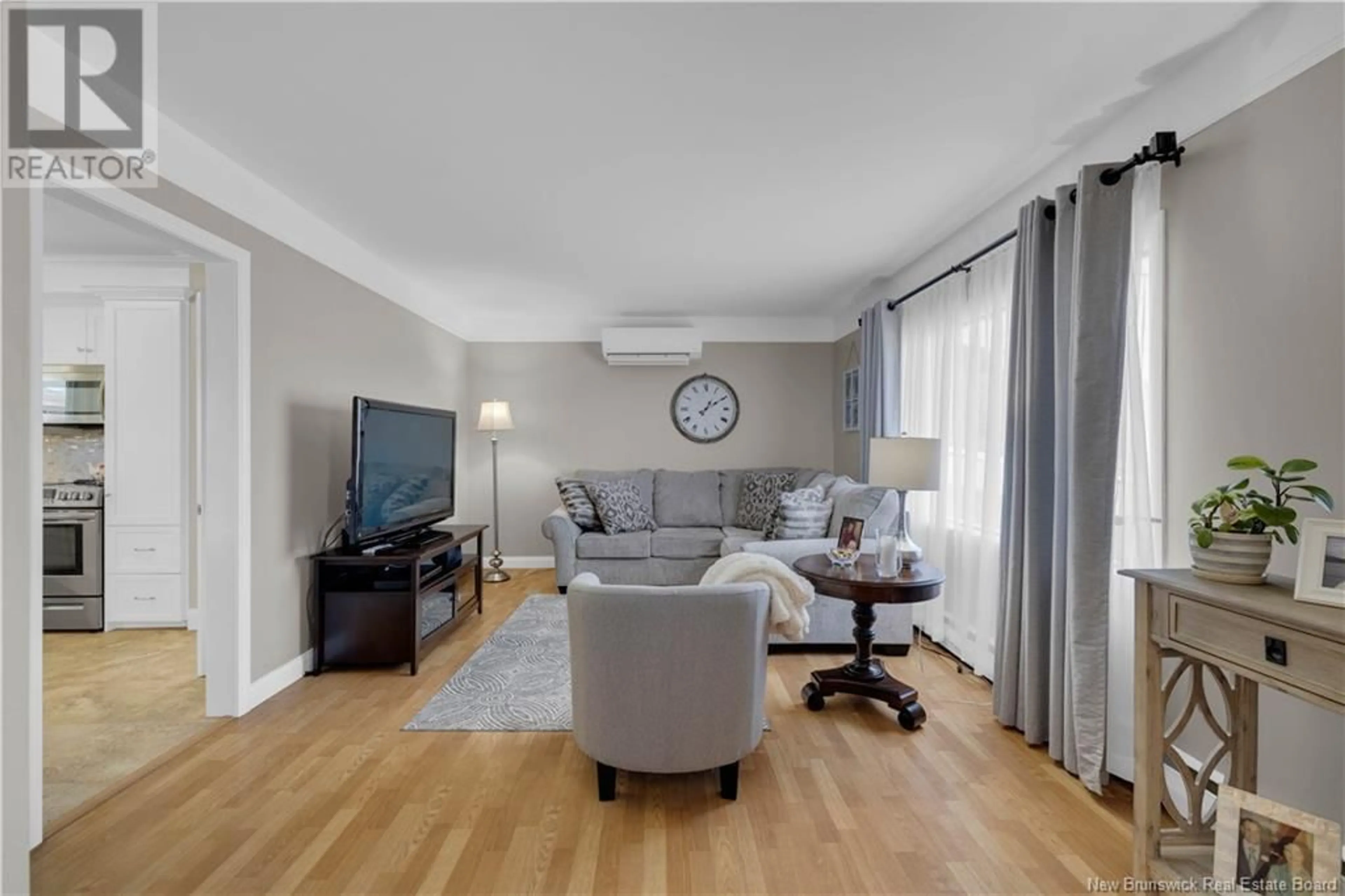 Living room with furniture, wood/laminate floor for 48 GLENGARRY DRIVE, Saint John New Brunswick E2J2Y3