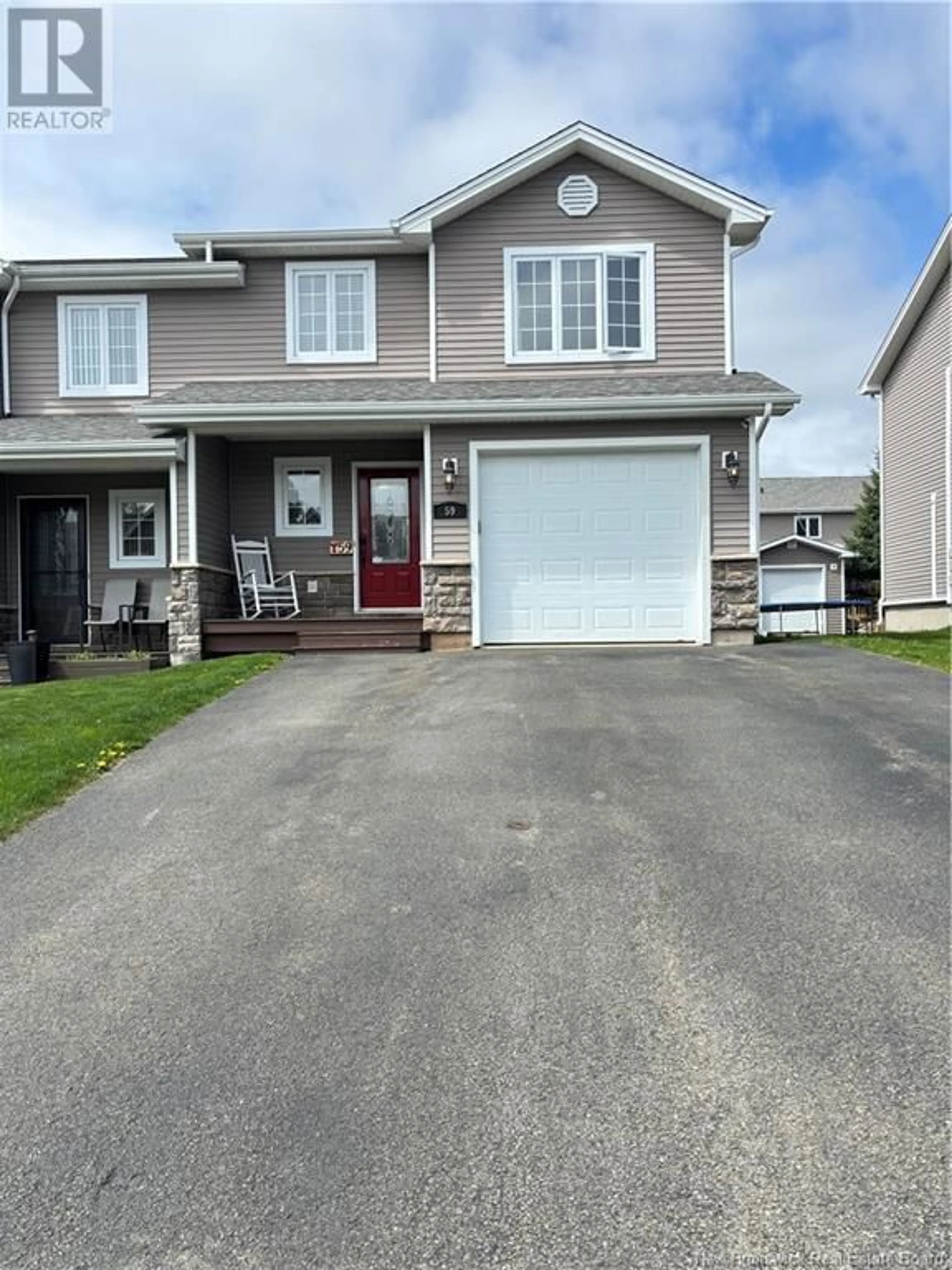 Home with vinyl exterior material, street for 59 LIONEL STREET, Dieppe New Brunswick E1A9C2