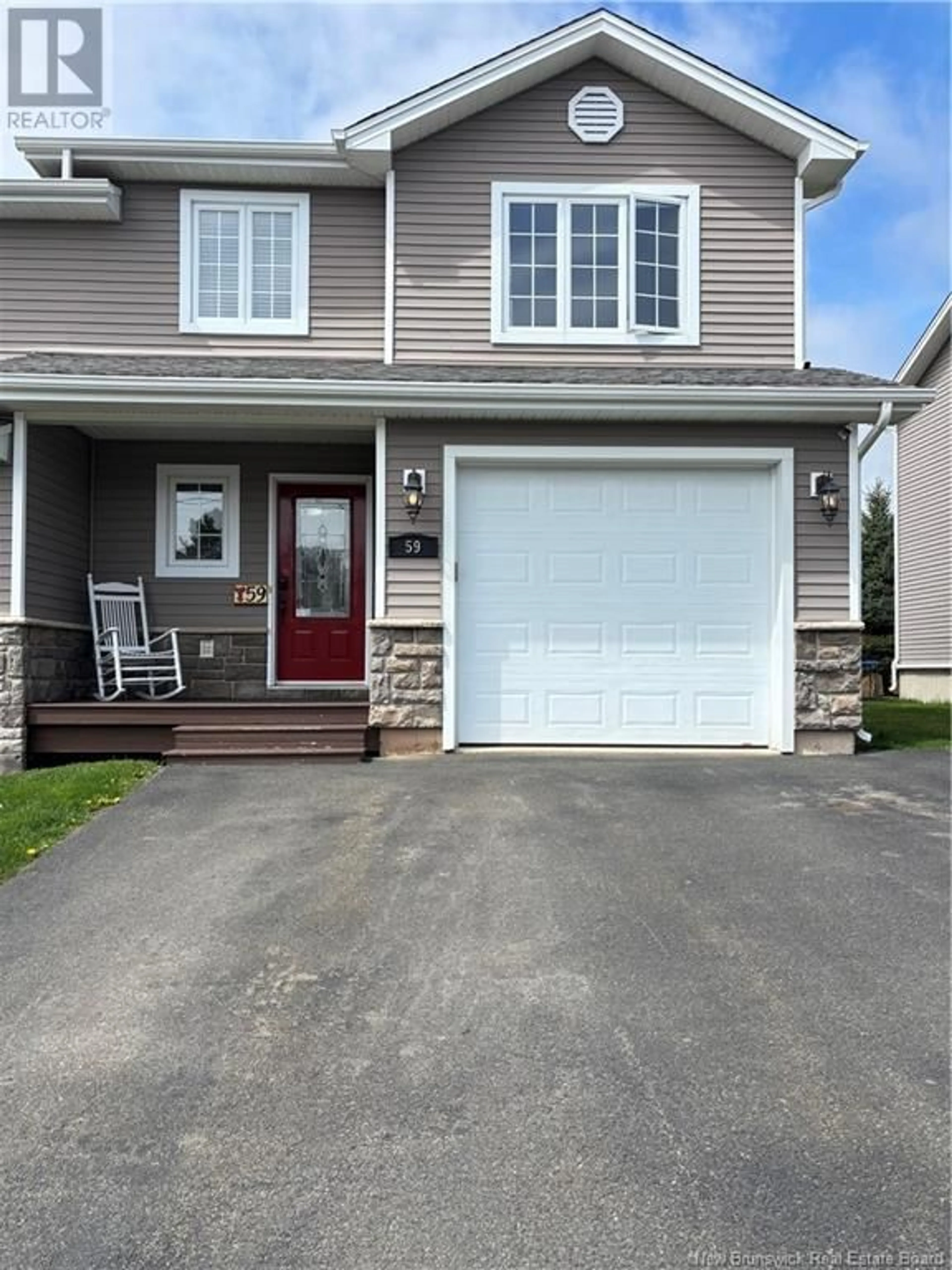 Home with vinyl exterior material, street for 59 LIONEL STREET, Dieppe New Brunswick E1A9C2