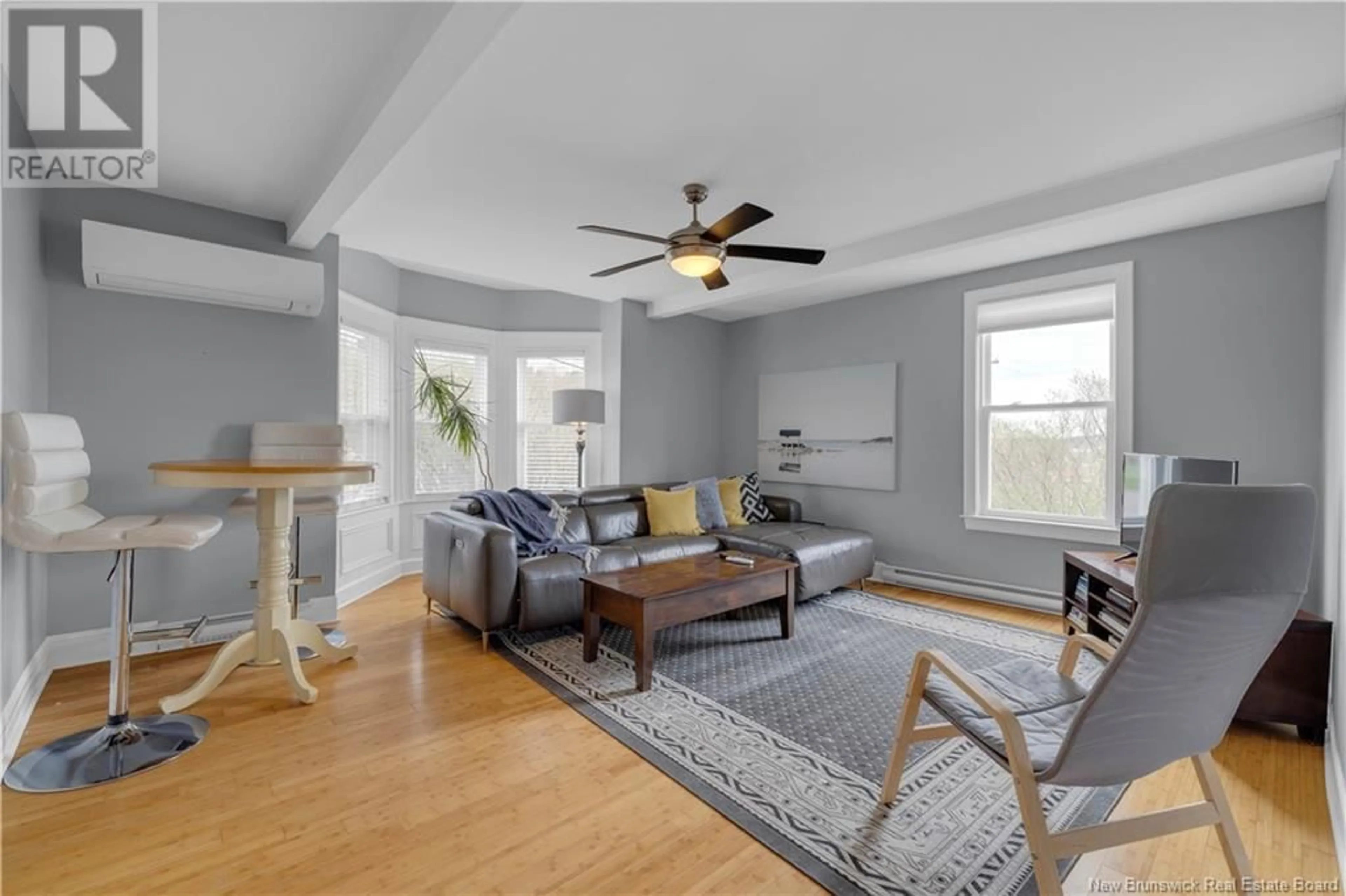Living room with furniture, wood/laminate floor for 89 SEELY STREET, Saint John New Brunswick E2K4B4