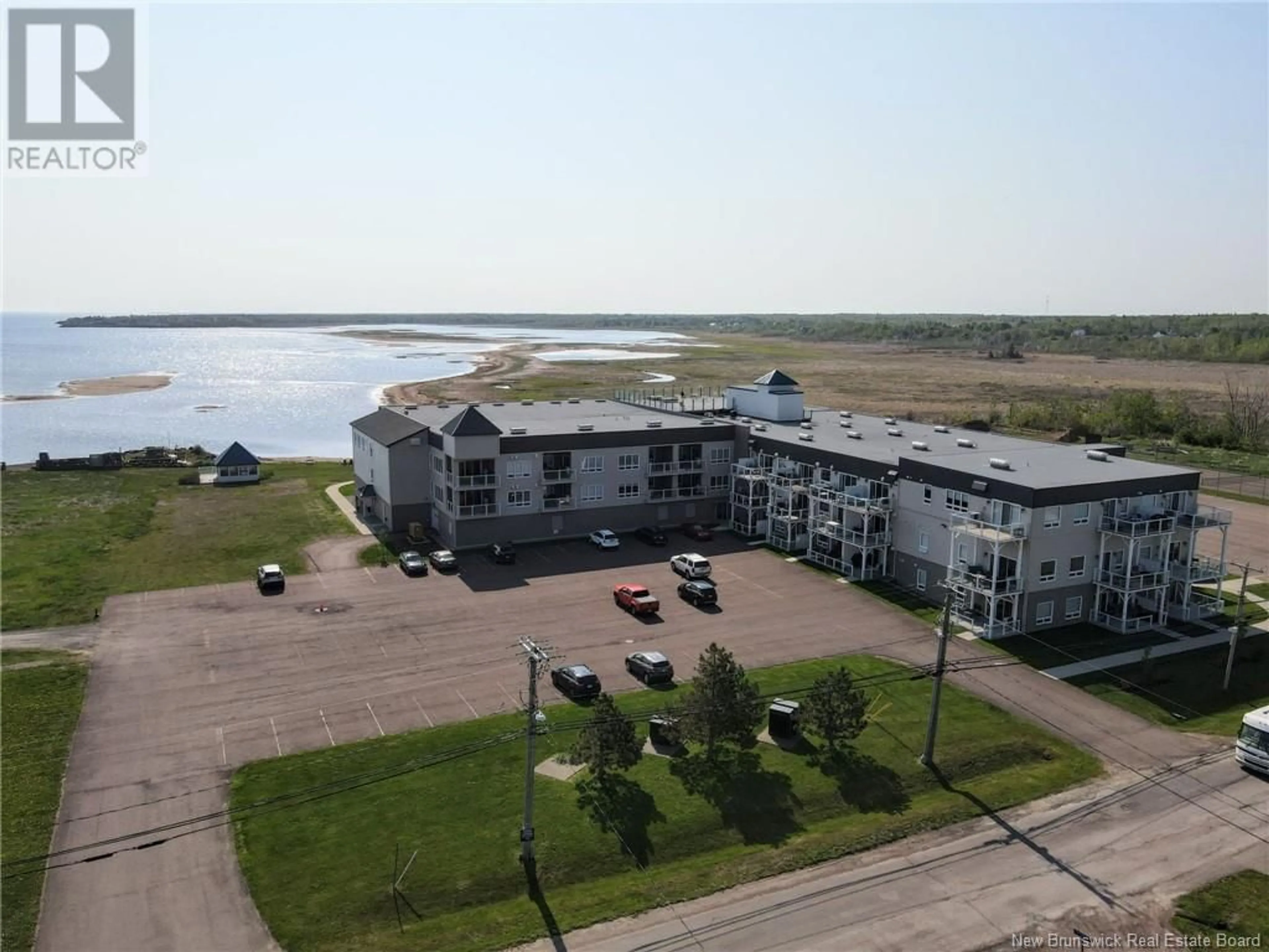 A pic from outside/outdoor area/front of a property/back of a property/a pic from drone, water/lake/river/ocean view for 216 - 69 CAP BIMET BOULEVARD, Beaubassin East New Brunswick E4P6X5