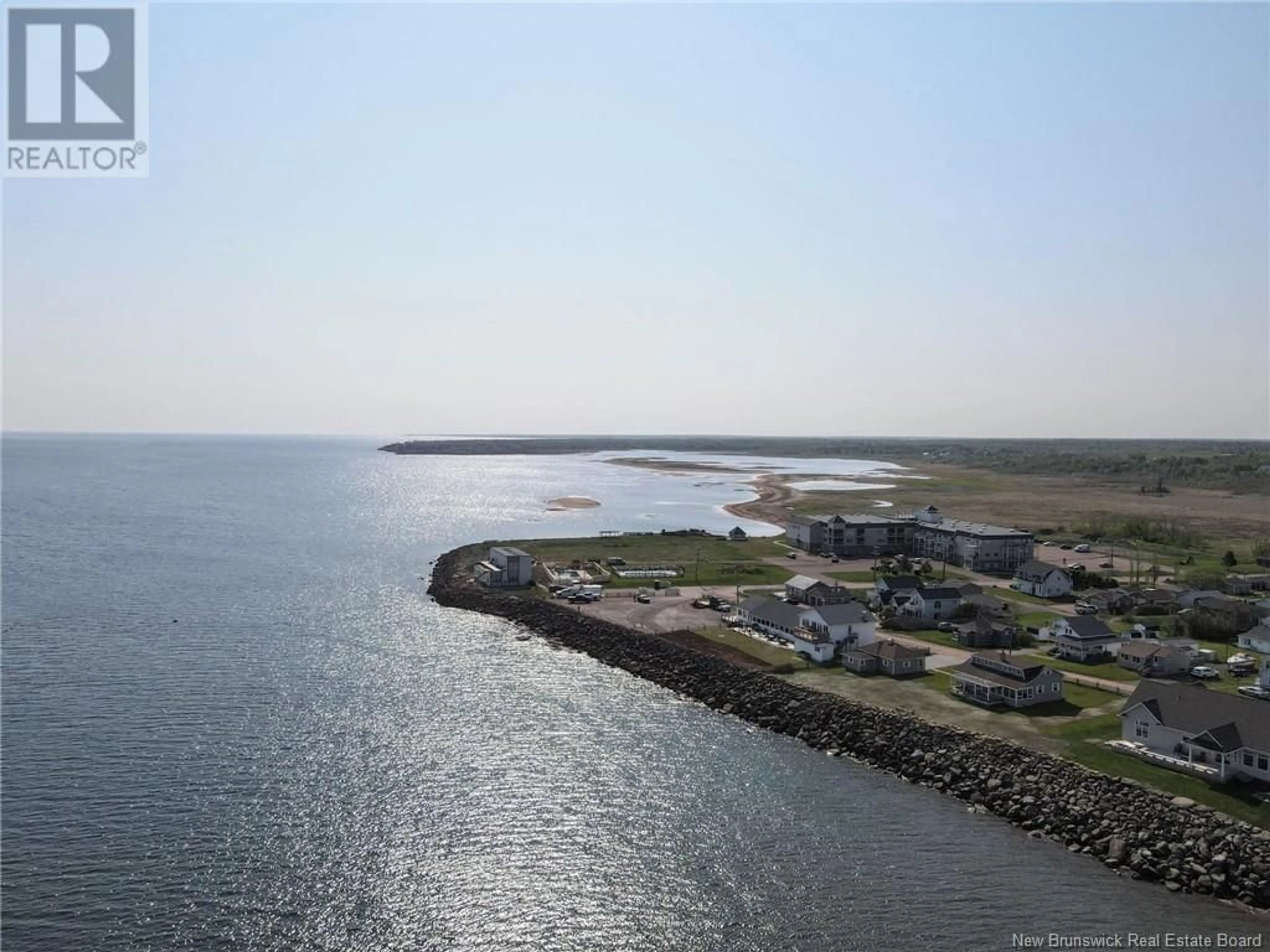 A pic from outside/outdoor area/front of a property/back of a property/a pic from drone, water/lake/river/ocean view for 216 - 69 CAP BIMET BOULEVARD, Beaubassin East New Brunswick E4P6X5