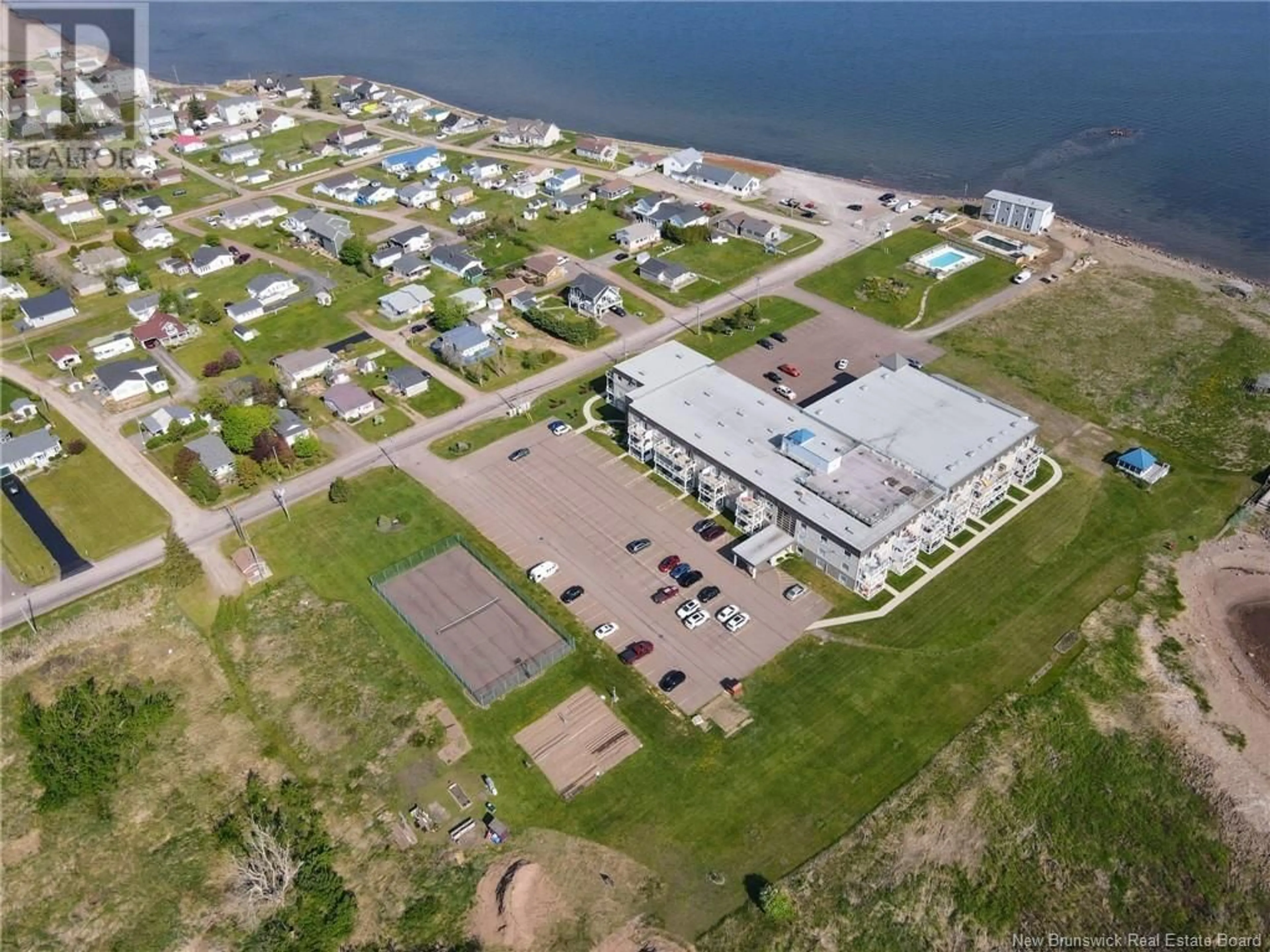 A pic from outside/outdoor area/front of a property/back of a property/a pic from drone, water/lake/river/ocean view for 216 - 69 CAP BIMET BOULEVARD, Beaubassin East New Brunswick E4P6X5