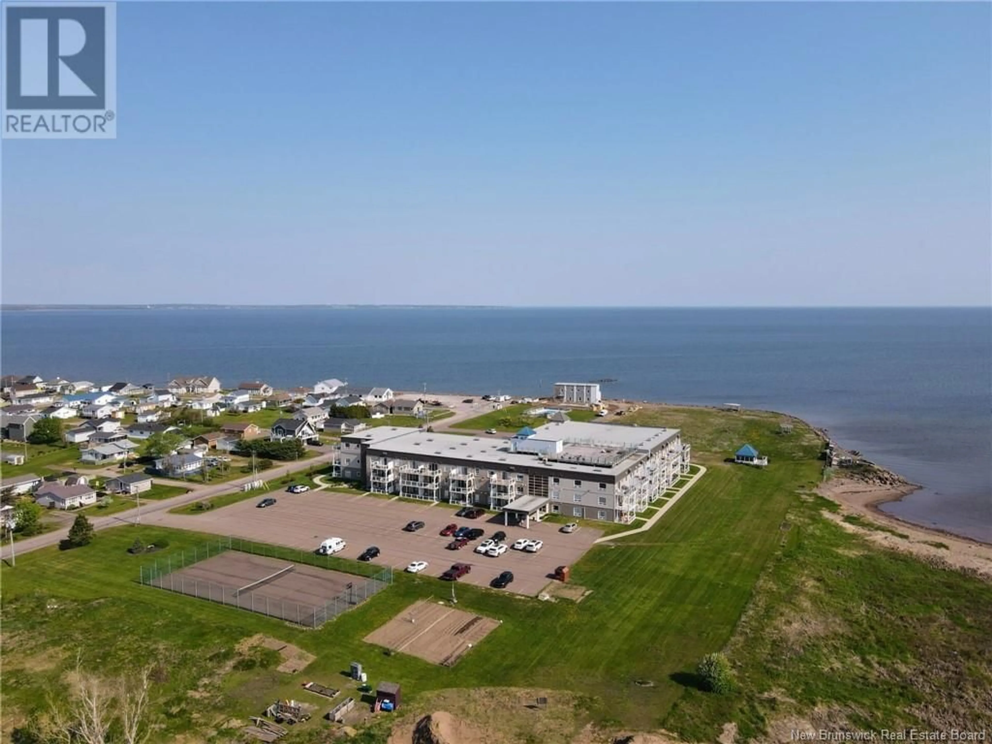 A pic from outside/outdoor area/front of a property/back of a property/a pic from drone, water/lake/river/ocean view for 216 - 69 CAP BIMET BOULEVARD, Beaubassin East New Brunswick E4P6X5