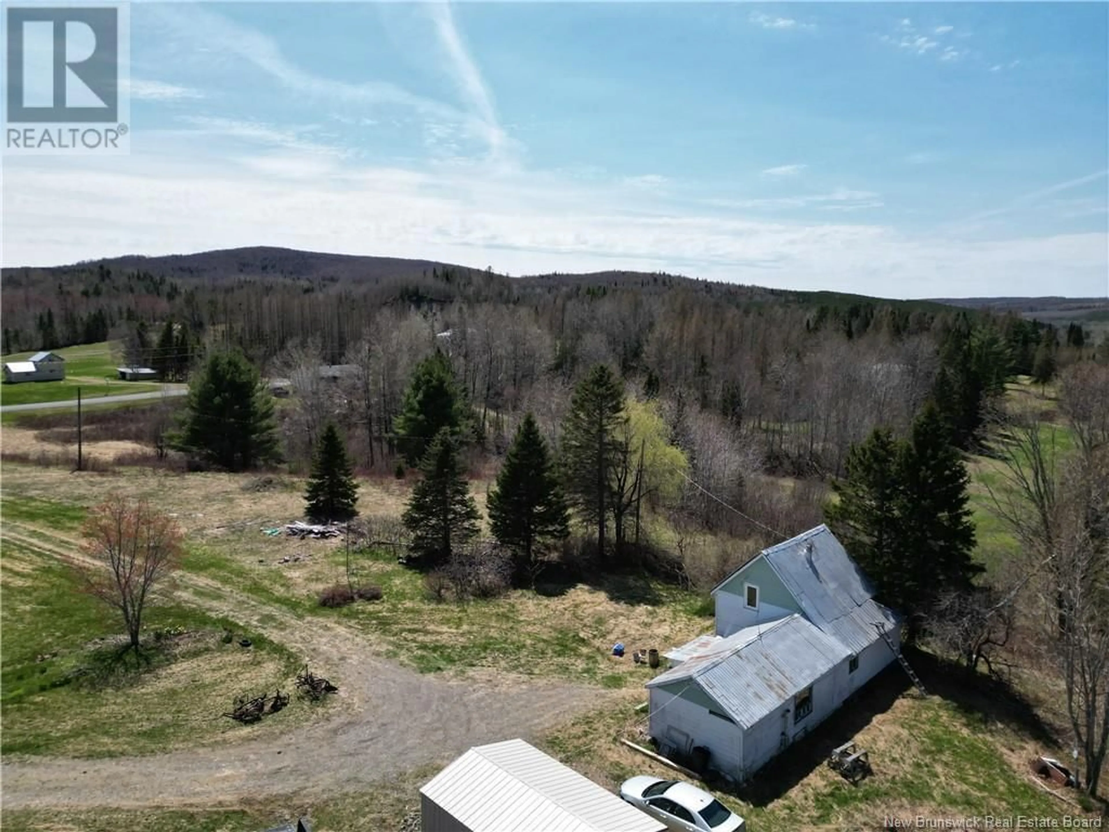 A pic from outside/outdoor area/front of a property/back of a property/a pic from drone, forest/trees view for 219 CHURCHLAND ROAD, Tilley New Brunswick E7H1S7