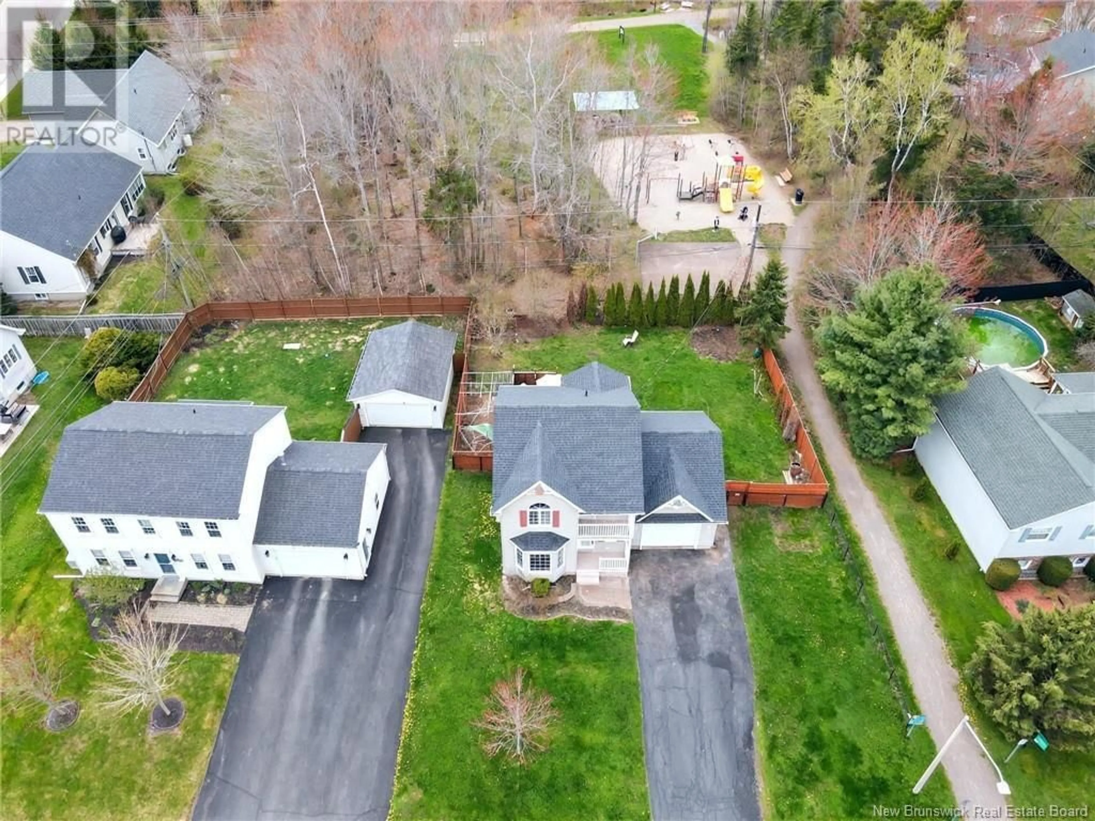 A pic from outside/outdoor area/front of a property/back of a property/a pic from drone, street for 1000 MUIRFIELD, Moncton New Brunswick E1G3T9