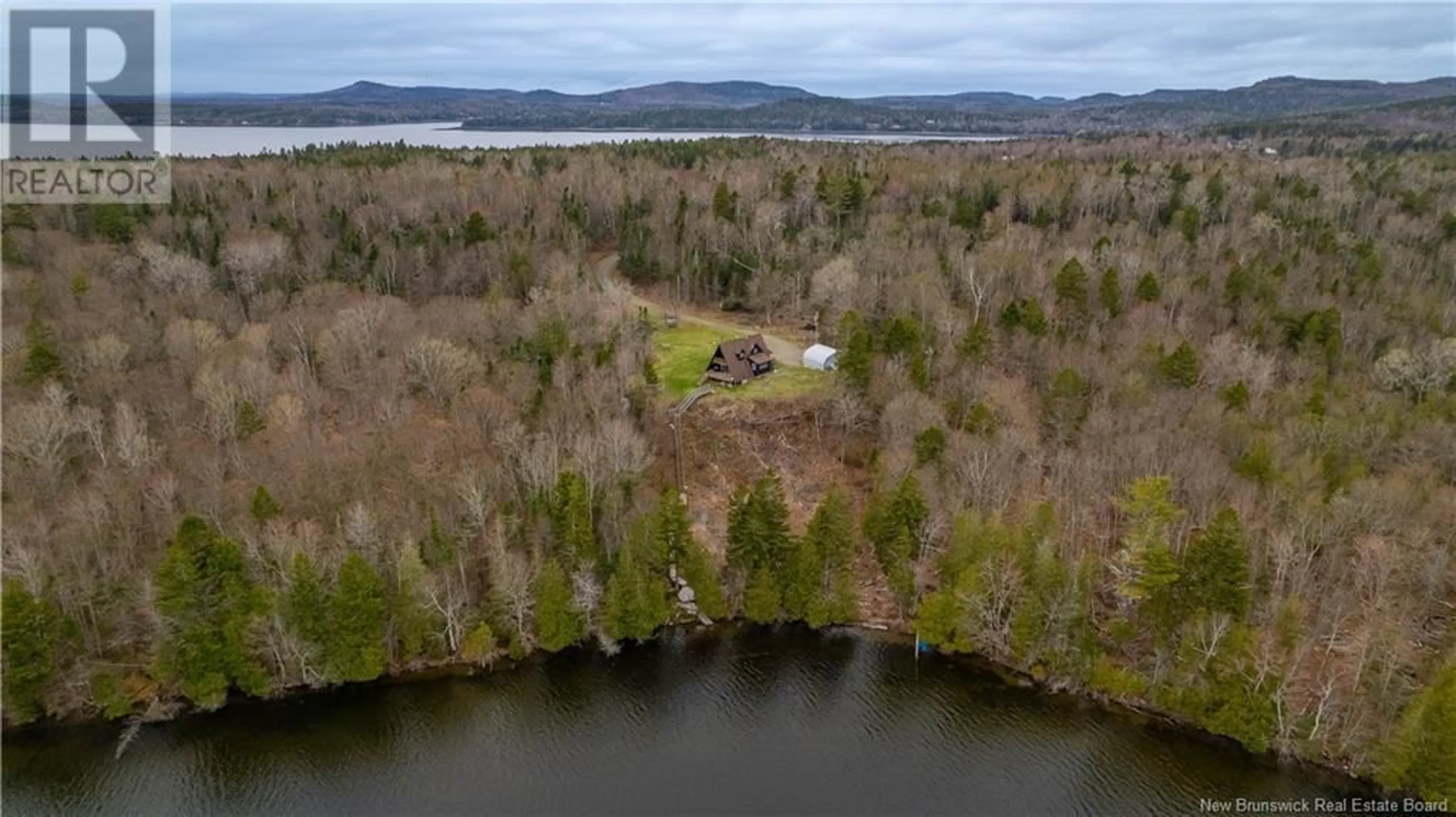 A pic from outside/outdoor area/front of a property/back of a property/a pic from drone, water/lake/river/ocean view for 49 HOLTS POINT ROAD, Bocabec New Brunswick E5B3N2