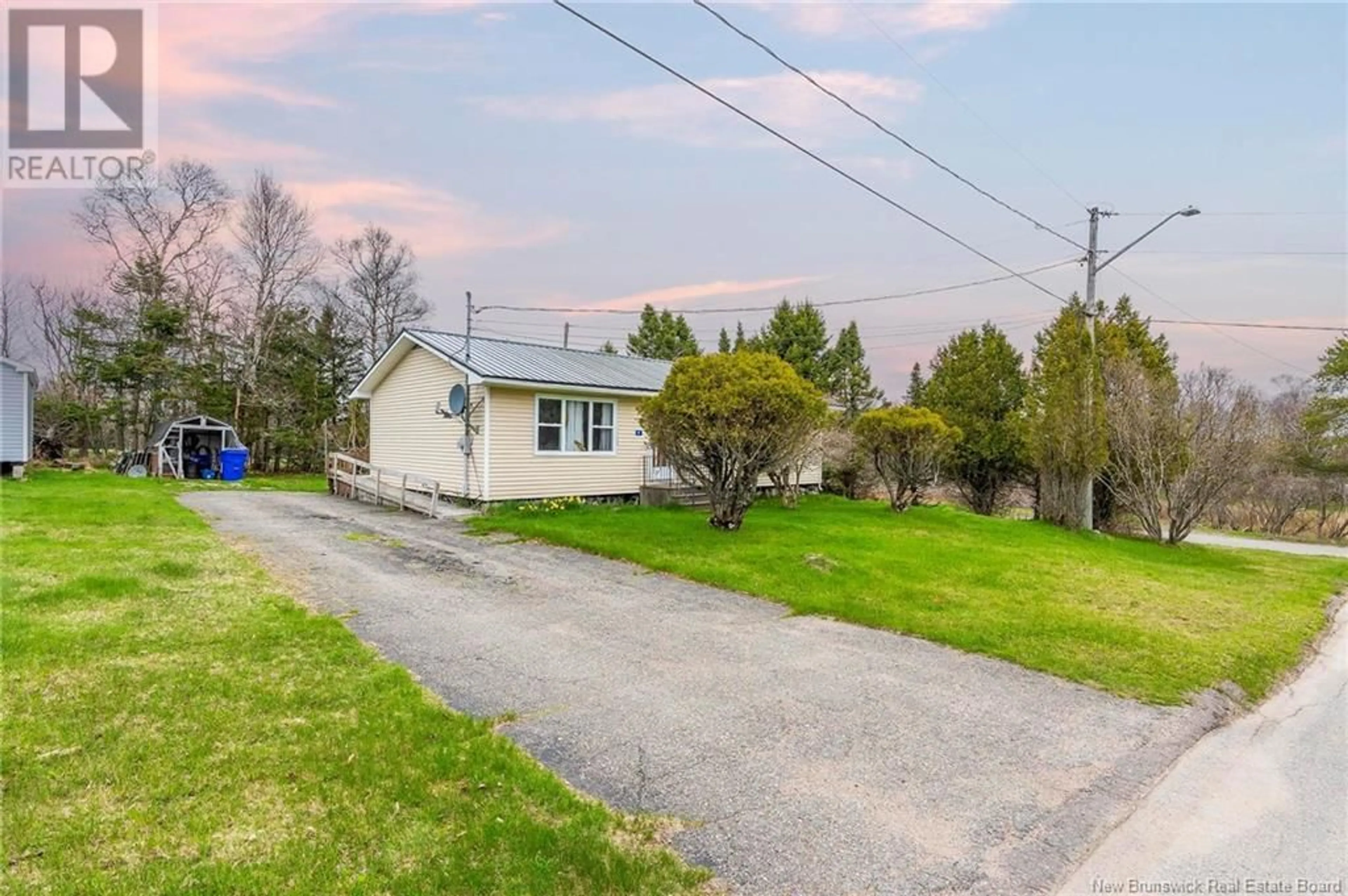 A pic from outside/outdoor area/front of a property/back of a property/a pic from drone, street for 4 HILLSIDE DRIVE, Blacks Harbour New Brunswick E5H1H5