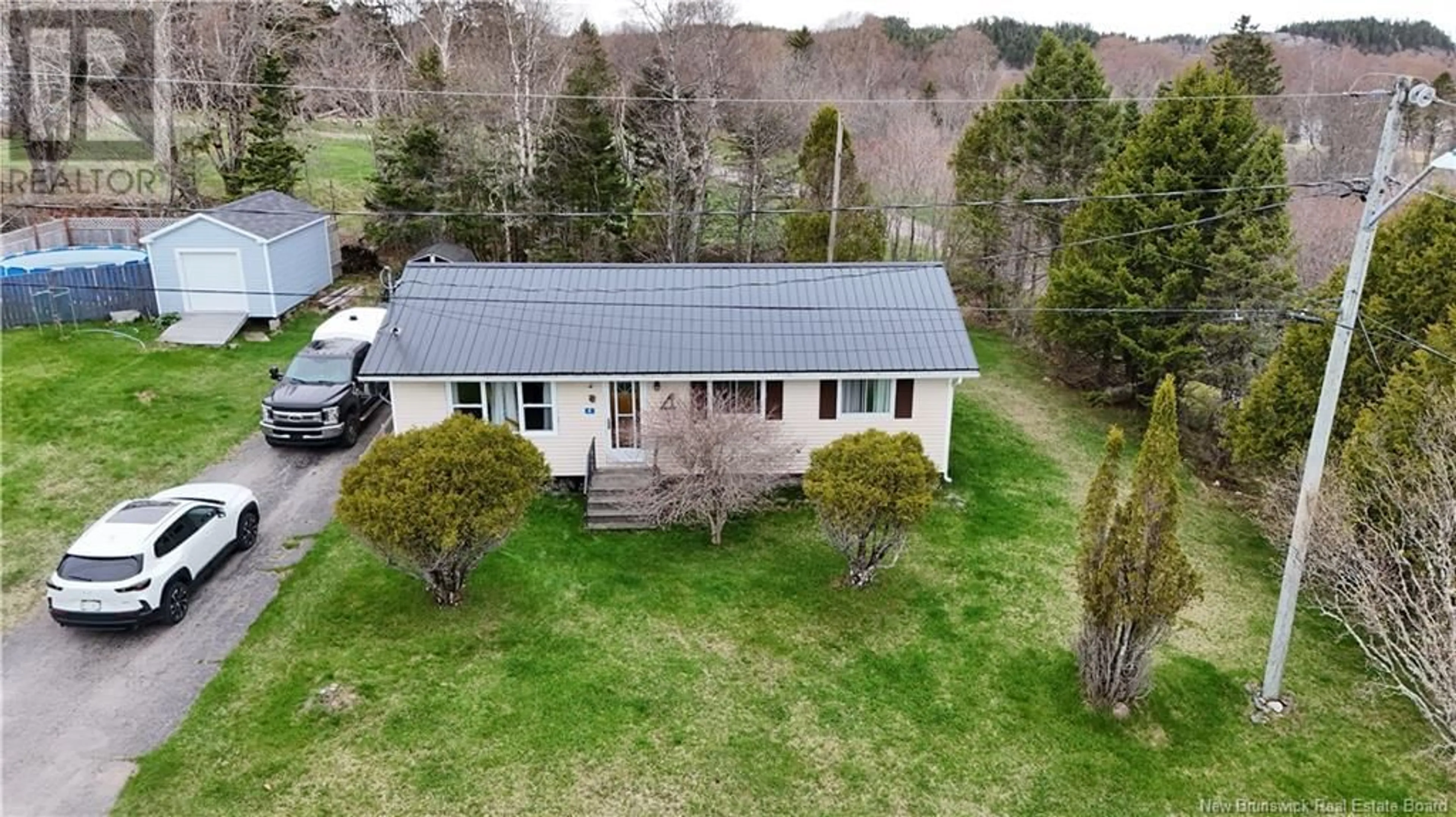 A pic from outside/outdoor area/front of a property/back of a property/a pic from drone, unknown for 4 HILLSIDE DRIVE, Blacks Harbour New Brunswick E5H1H5