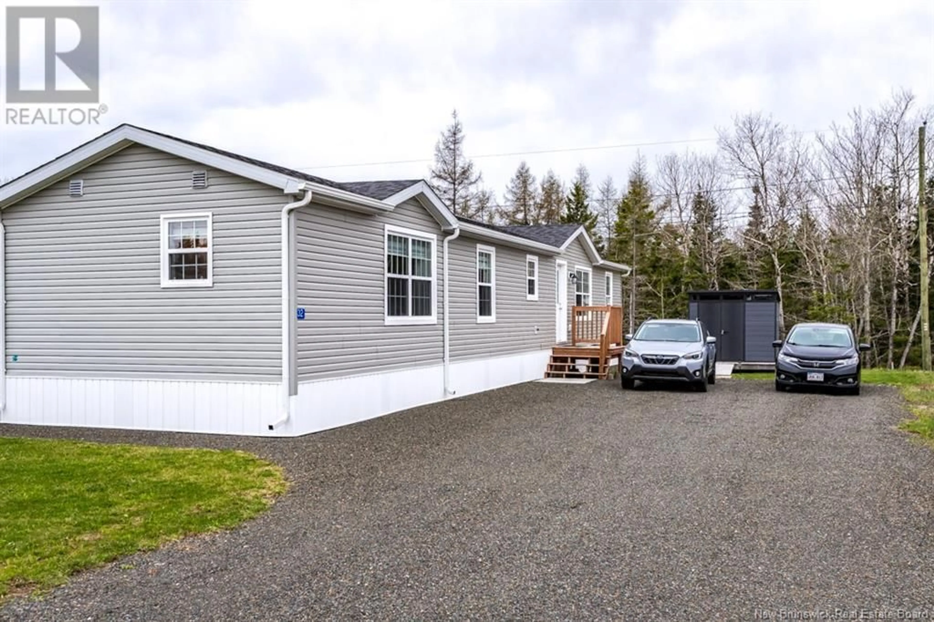 Home with vinyl exterior material, street for 32 HARVEST LANE, St George New Brunswick E5C0C4