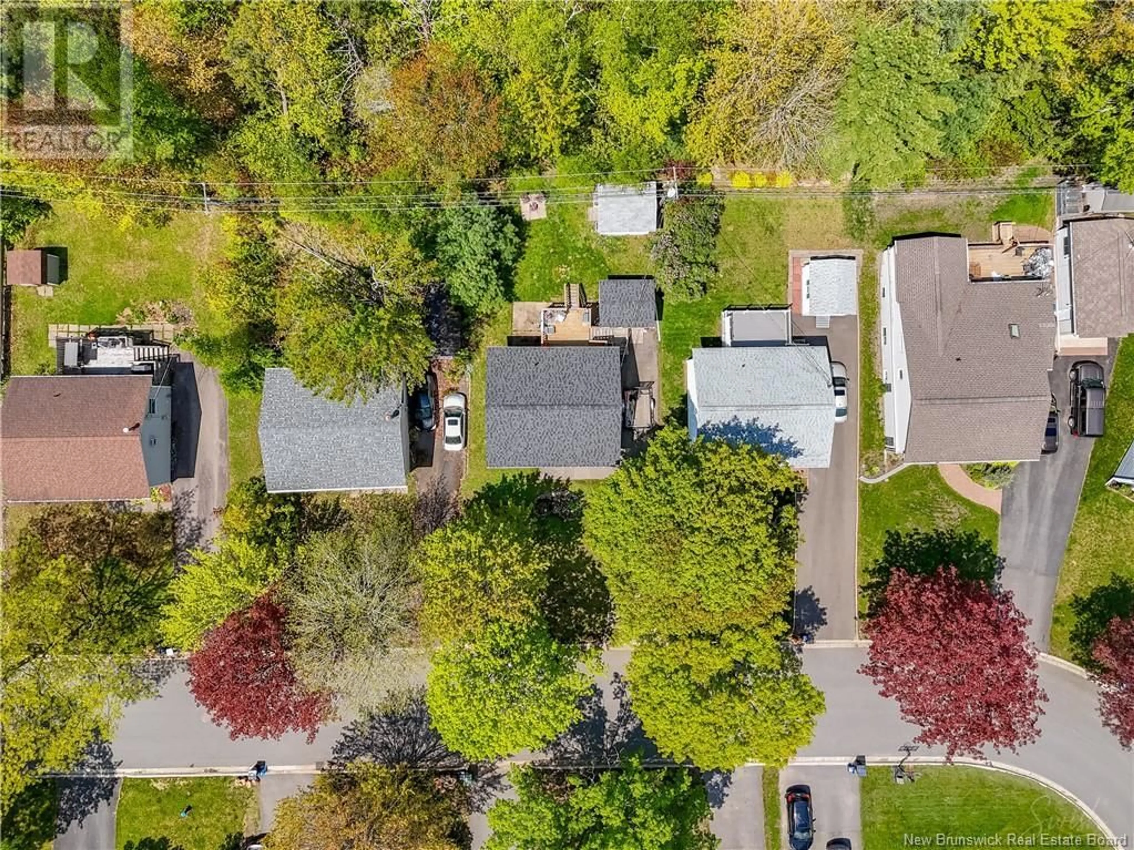 A pic from outside/outdoor area/front of a property/back of a property/a pic from drone, street for 11 LILAC CRESCENT, Fredericton New Brunswick E3A2G7