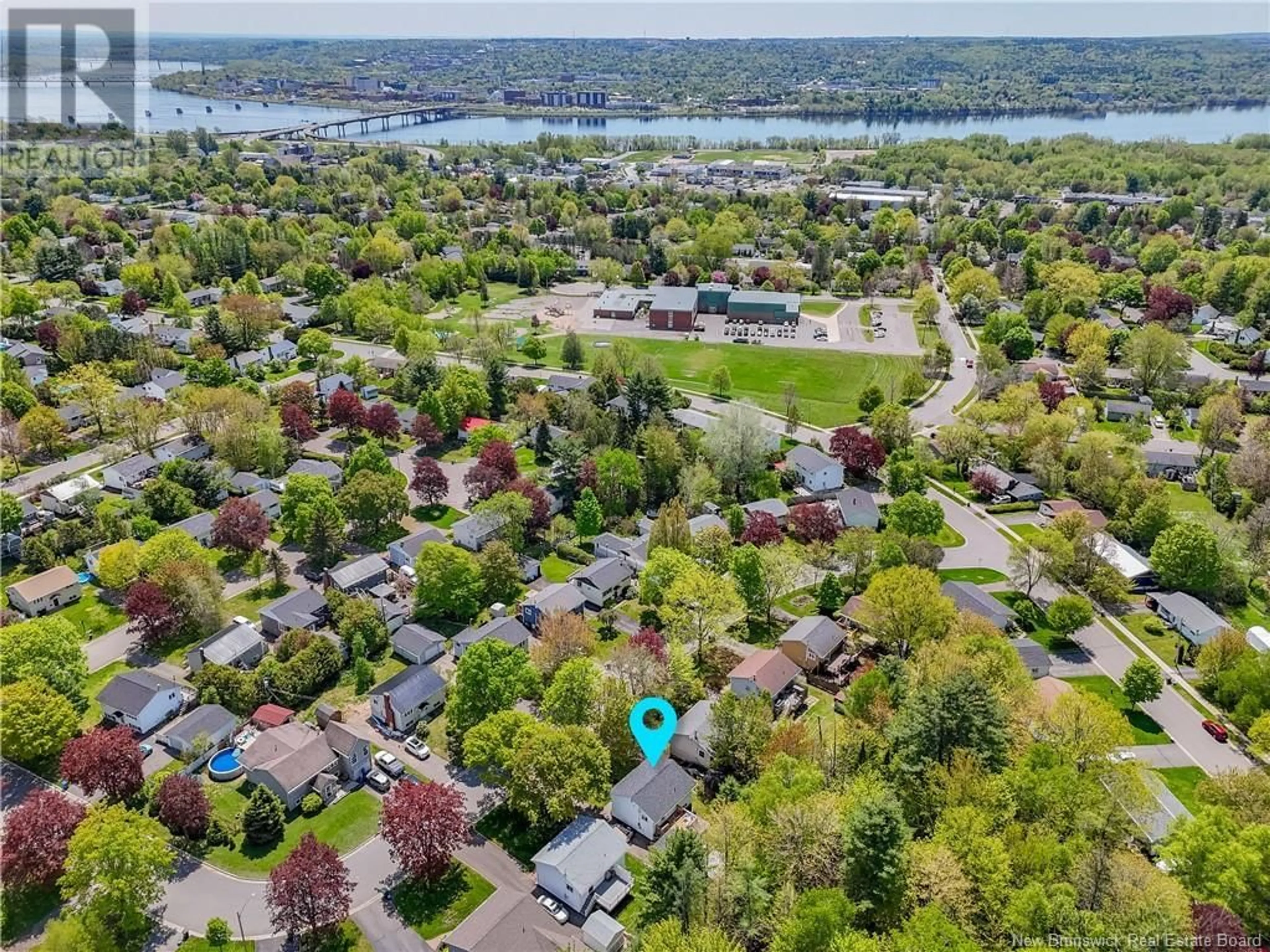 A pic from outside/outdoor area/front of a property/back of a property/a pic from drone, water/lake/river/ocean view for 11 LILAC CRESCENT, Fredericton New Brunswick E3A2G7