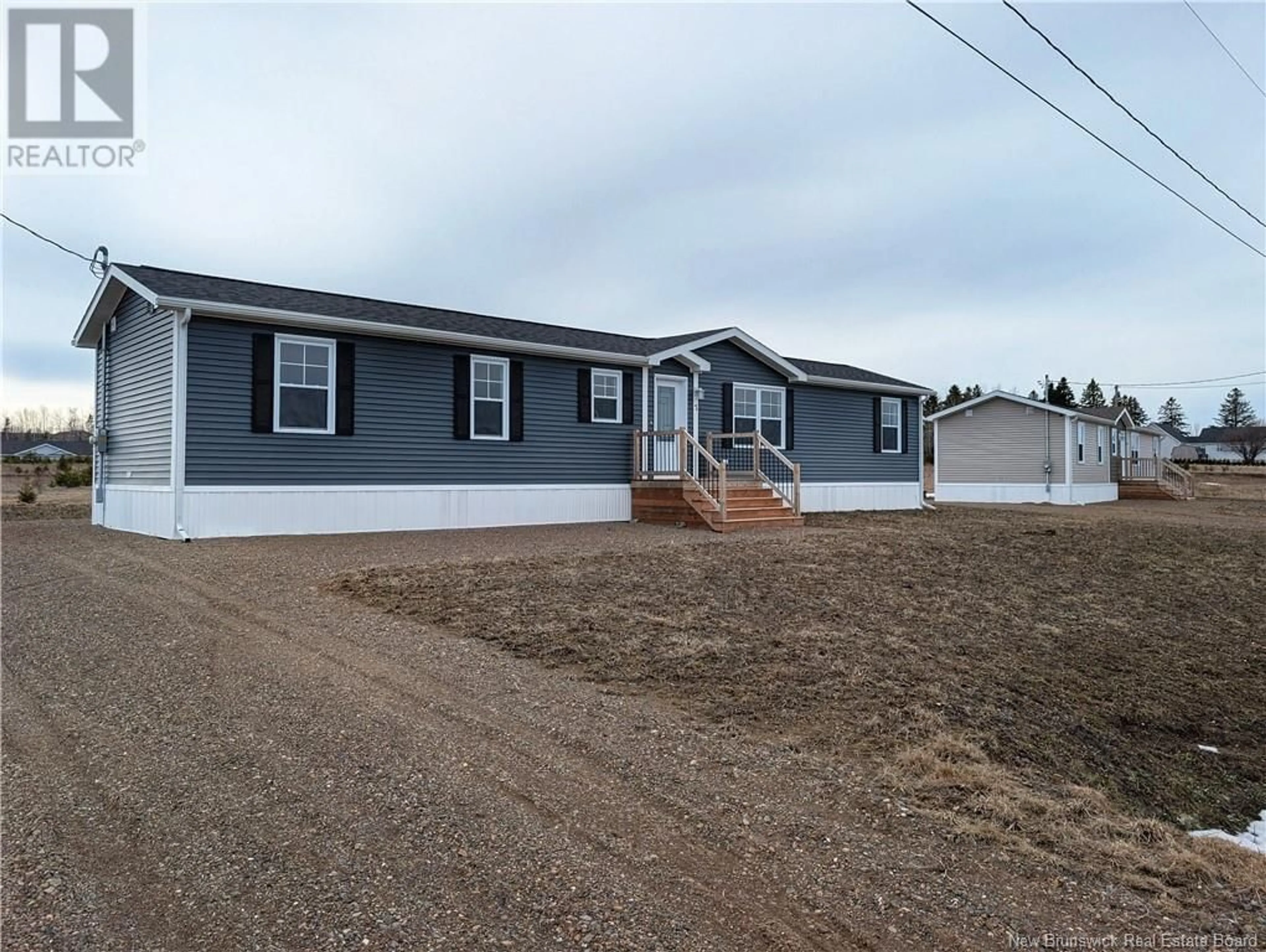 Home with vinyl exterior material, street for 7 CHRISTINE/MARTIN STREET, Saint-Isidore New Brunswick E8M0B3