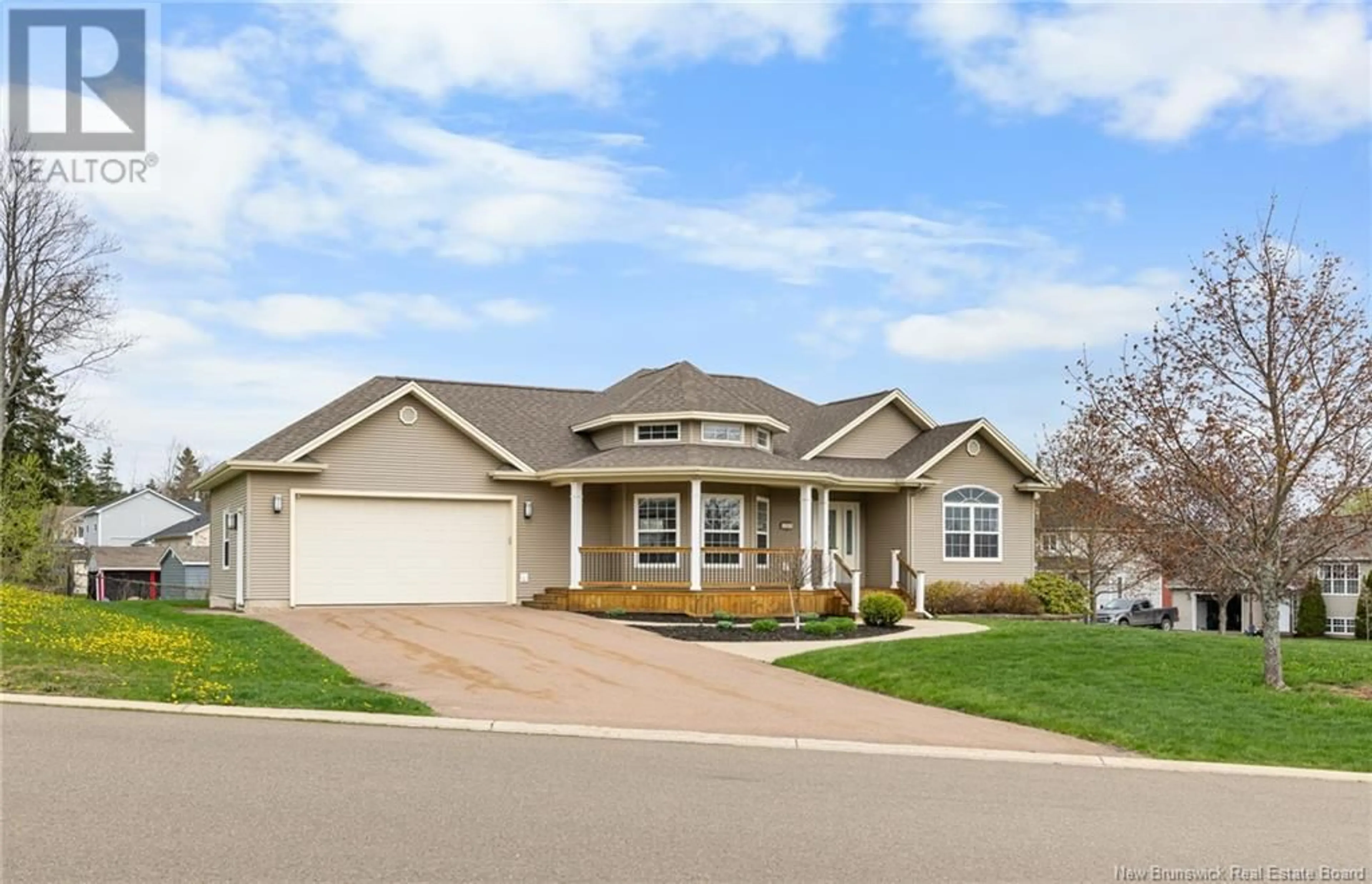 Home with vinyl exterior material, street for 105 MEUNIER, Dieppe New Brunswick E1A7W9