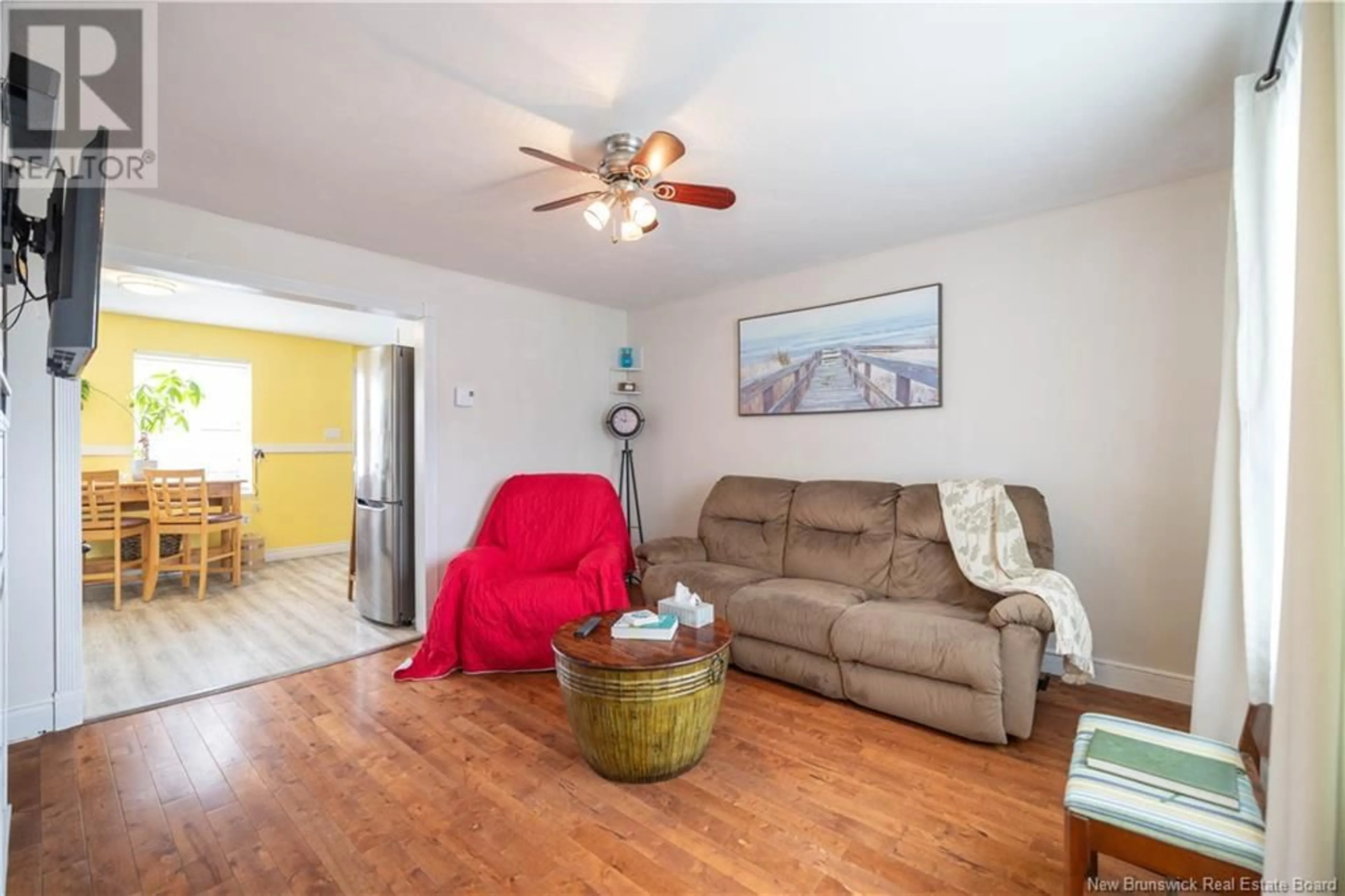 Living room with furniture, wood/laminate floor for 8 MCKENNA CRESCENT, Saint John New Brunswick E2K4E1