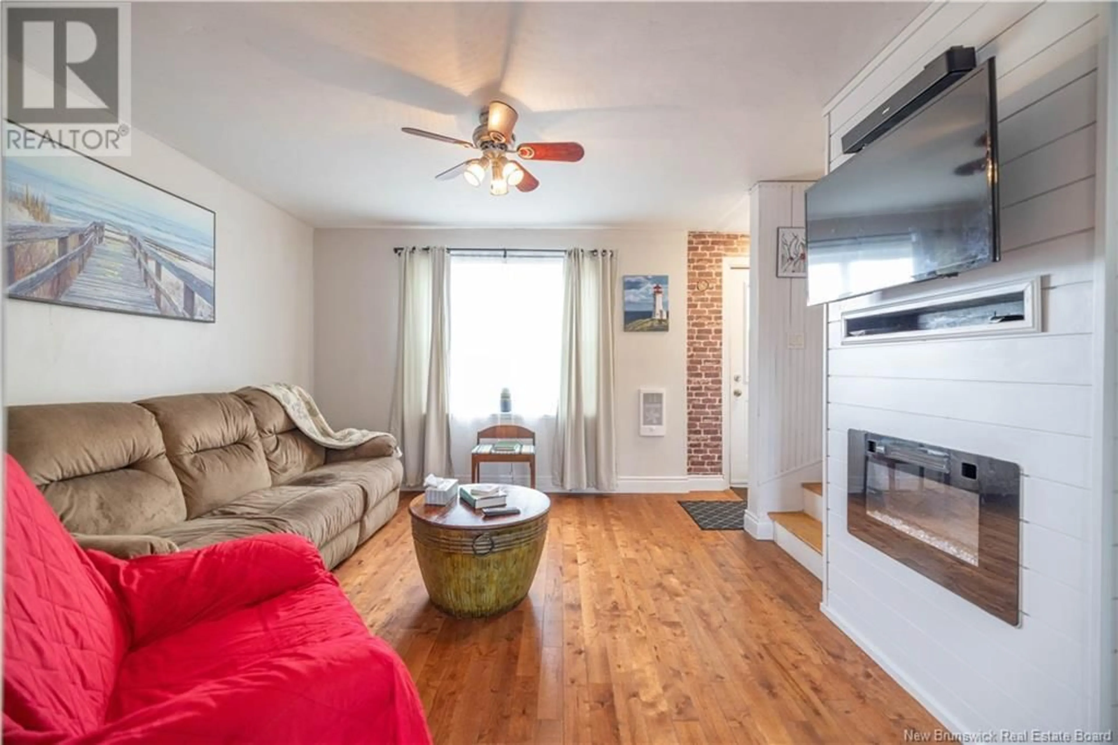 Living room with furniture, wood/laminate floor for 8 MCKENNA CRESCENT, Saint John New Brunswick E2K4E1