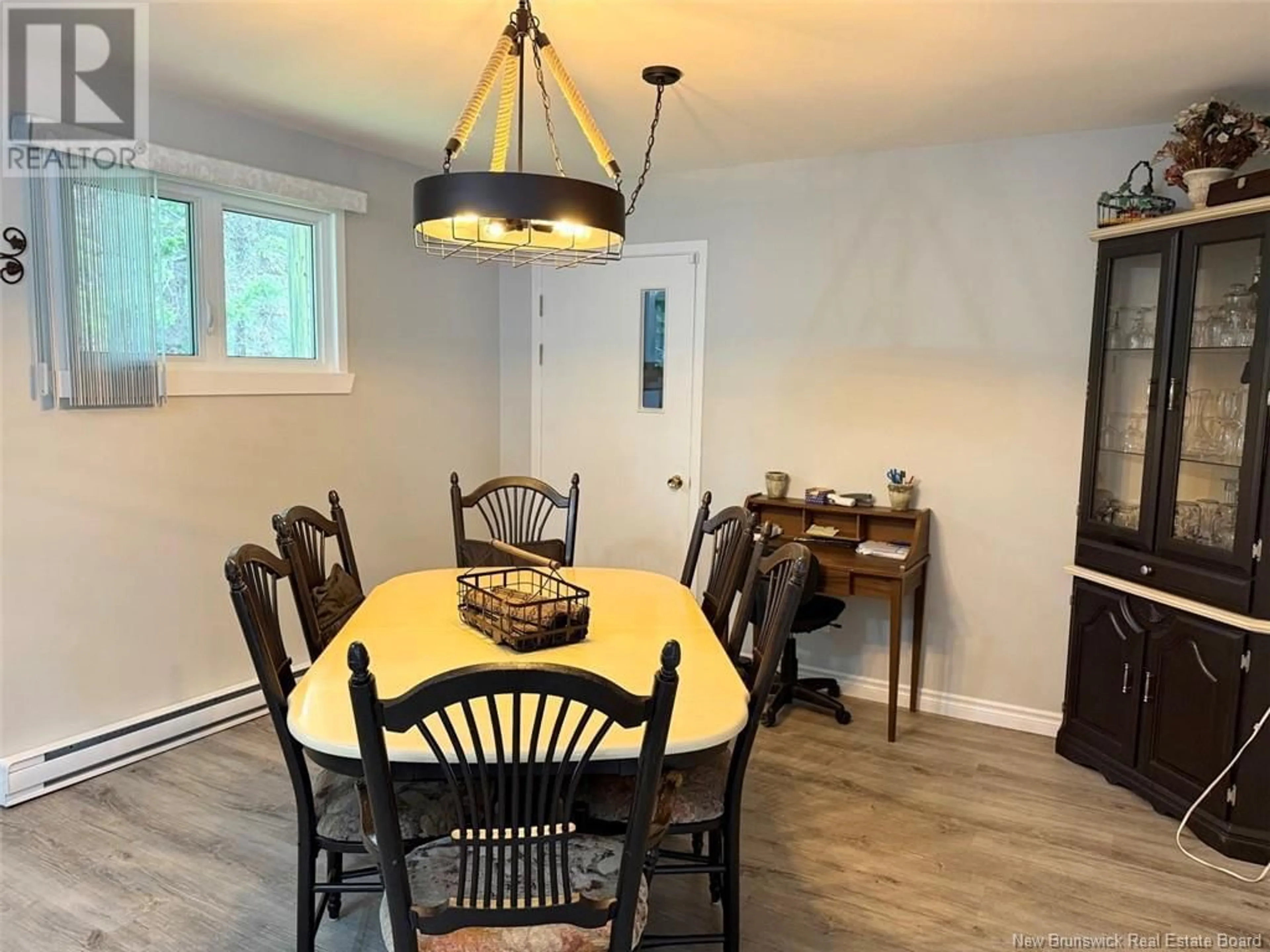 Dining room, wood/laminate floor for 111 ROUTE 260, Saint-Quentin New Brunswick E8A2L5