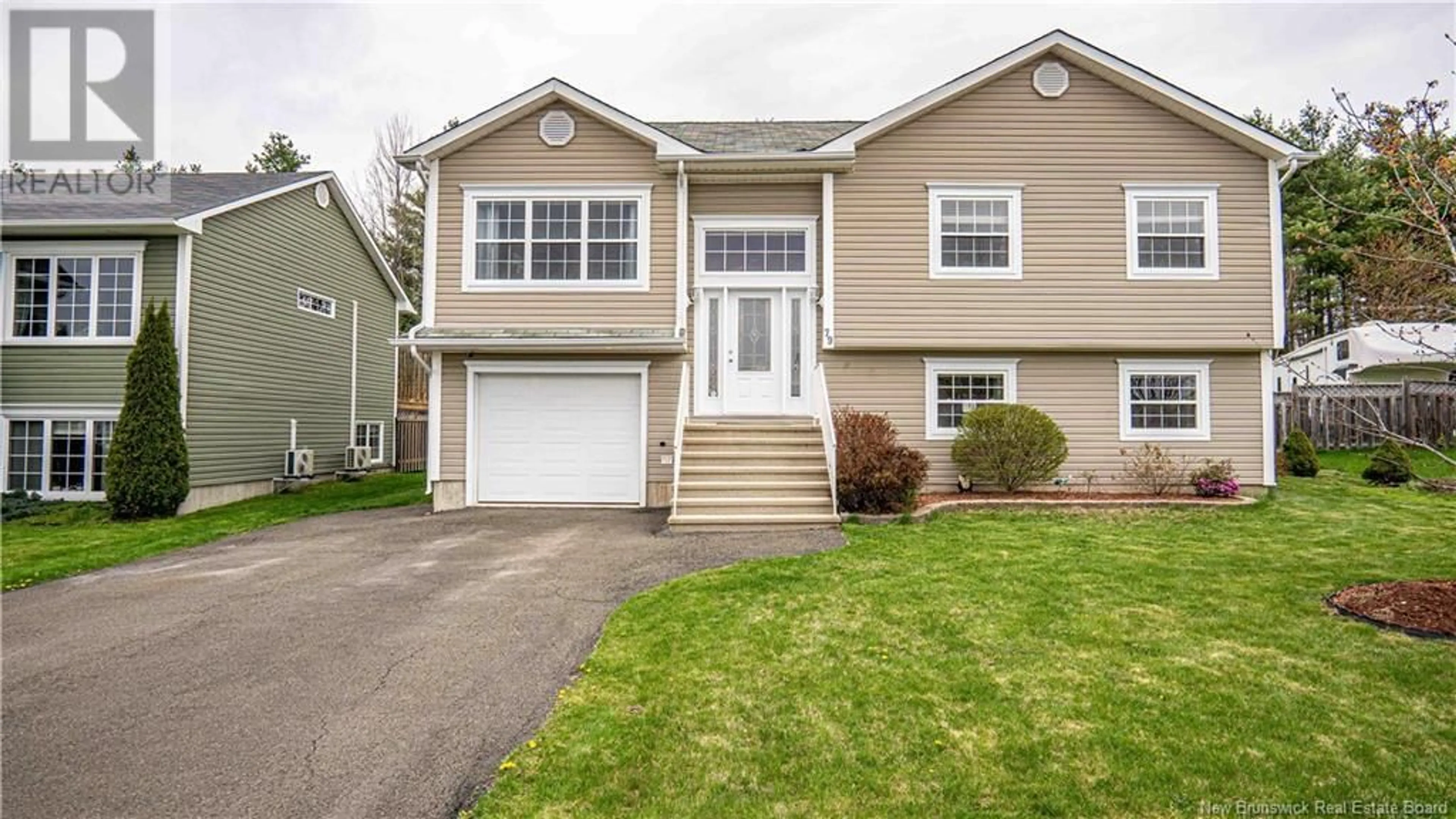 Home with vinyl exterior material, street for 79 DAWSON DRIVE, Oromocto New Brunswick E2V4S9