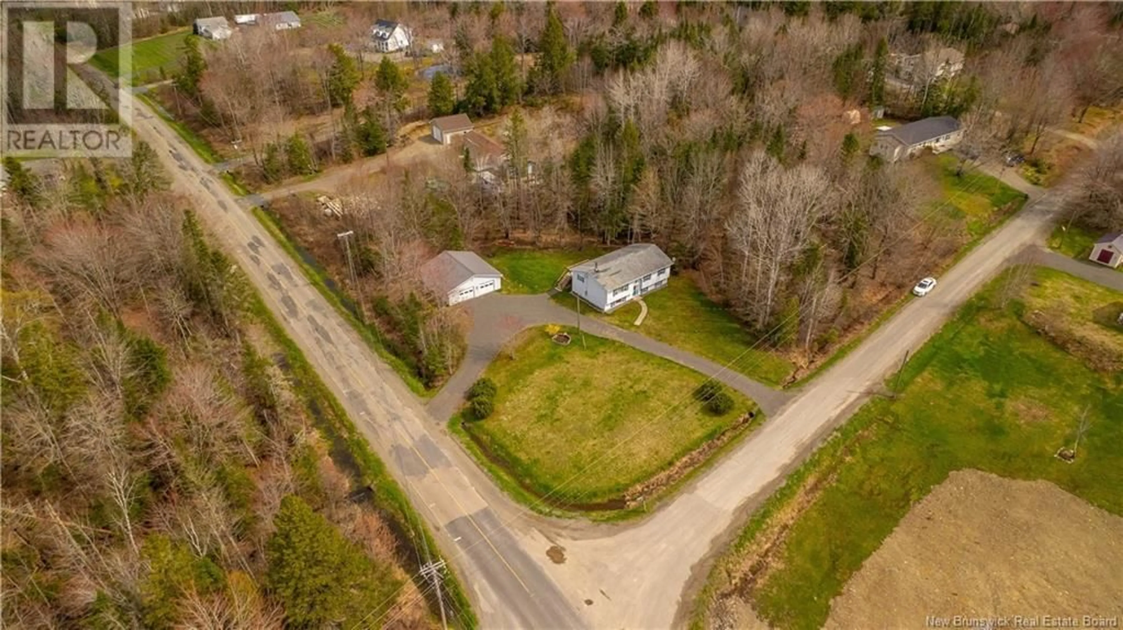 A pic from outside/outdoor area/front of a property/back of a property/a pic from drone, street for 1 MCKNIGHT ROAD, Valley Road New Brunswick E3L4V4