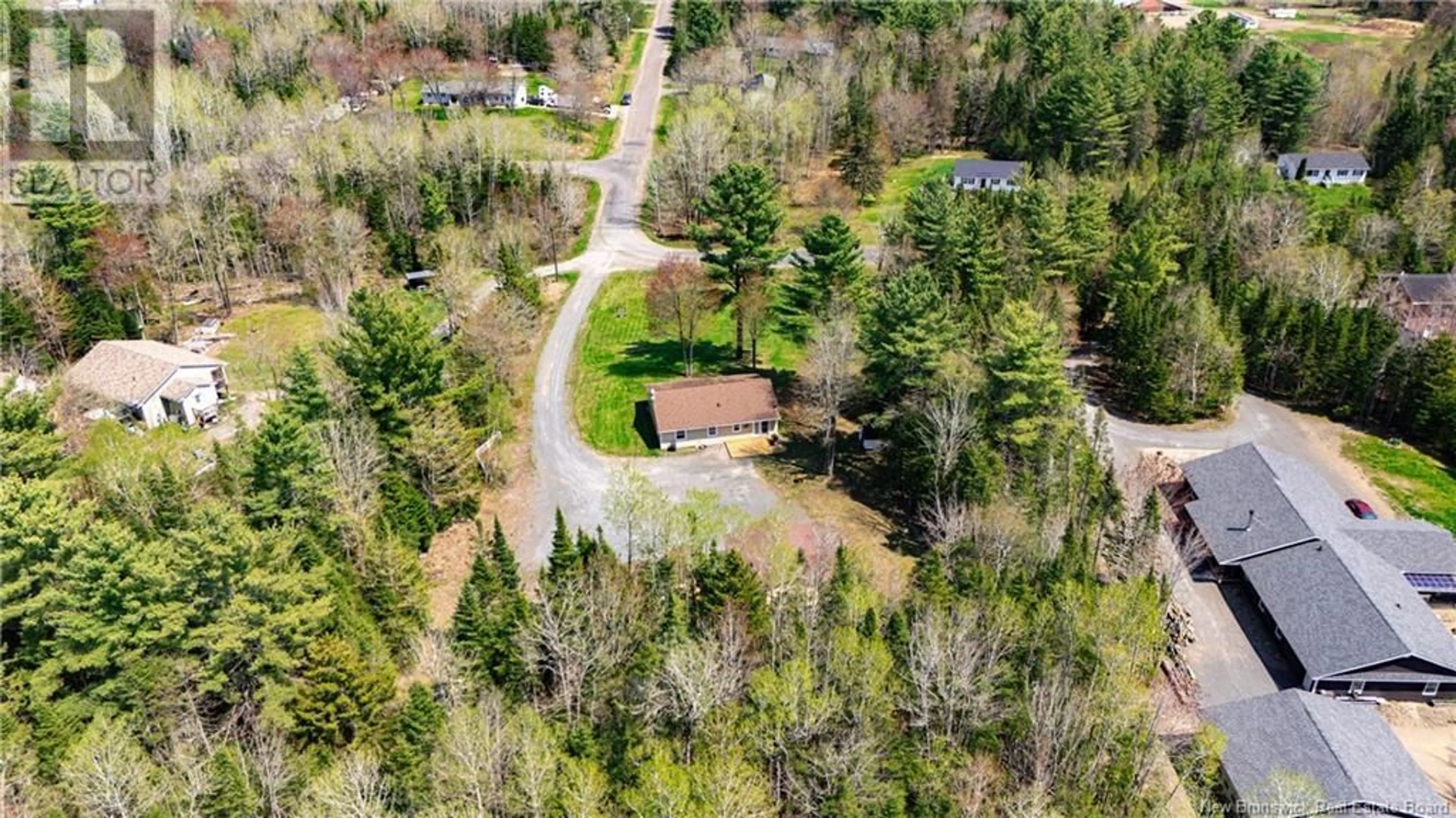 A pic from outside/outdoor area/front of a property/back of a property/a pic from drone, forest/trees view for 10 RALPH STREET, Noonan New Brunswick E3A0K9