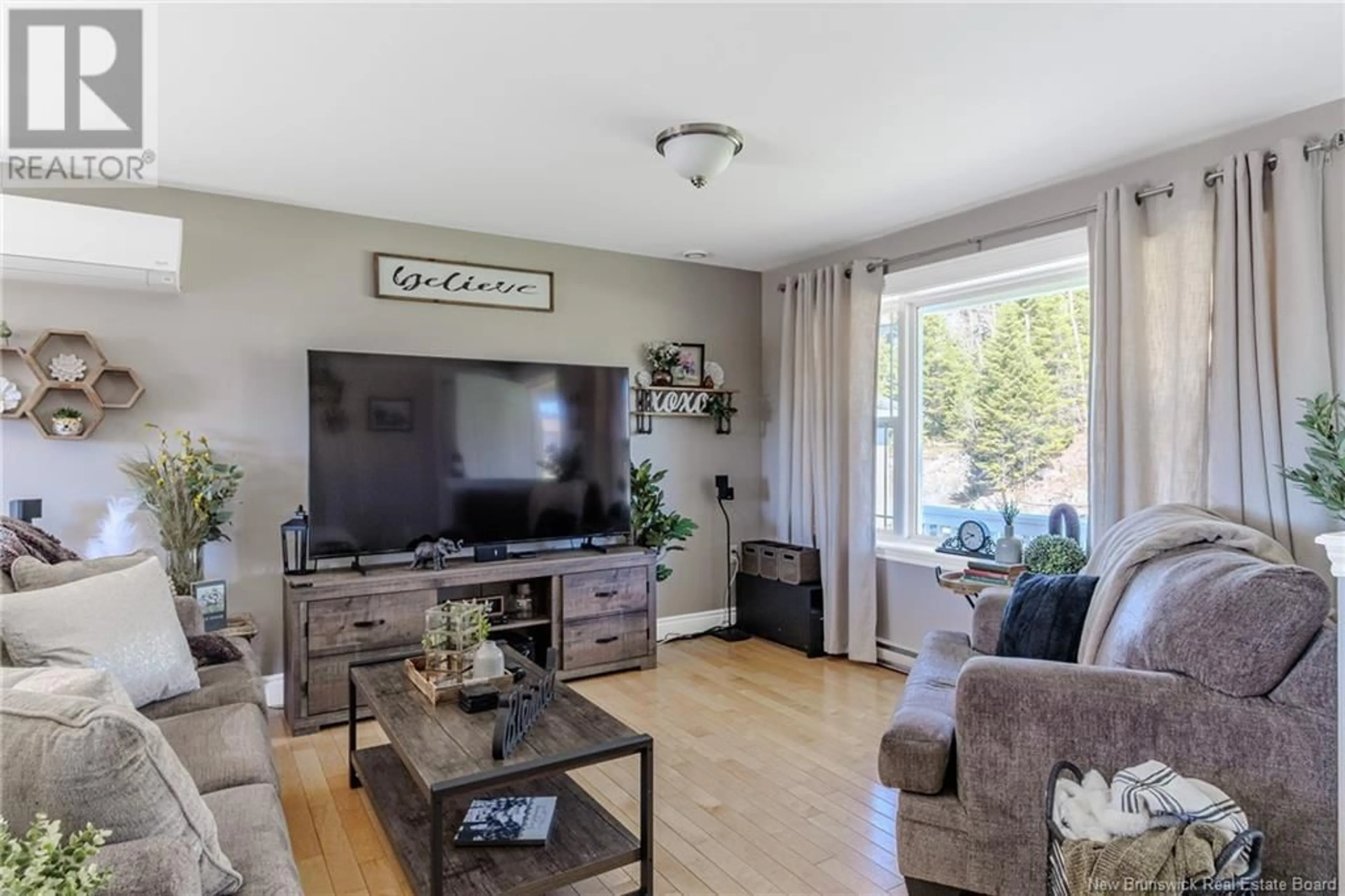 Living room with furniture, wood/laminate floor for 25 REBA ROAD, Saint John New Brunswick E2J0E4