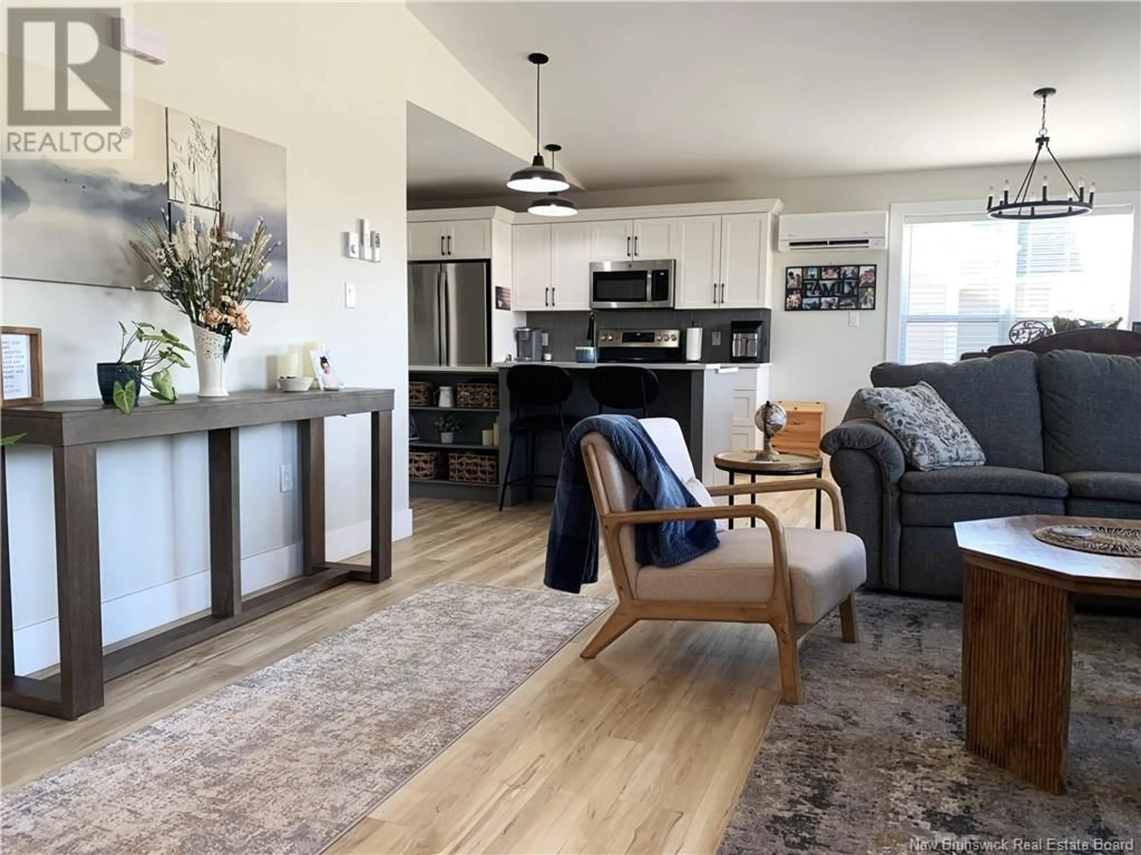 Open concept kitchen, wood/laminate floor for 116 ST. PIERRE DRIVE, Fredericton New Brunswick E3C0C3