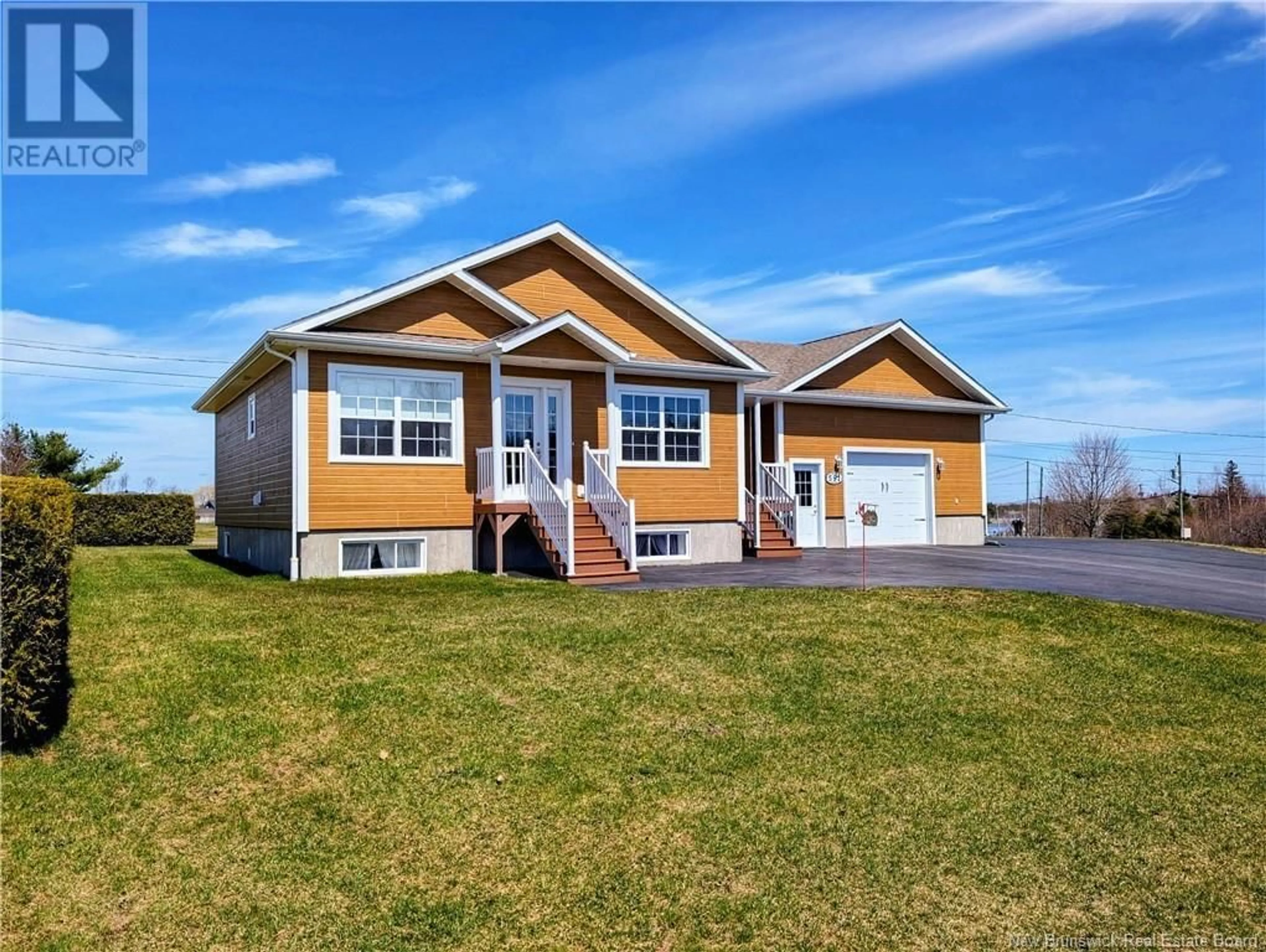 Home with vinyl exterior material, street for 591 RUE ANTHIME, Tracadie New Brunswick E1X1A5