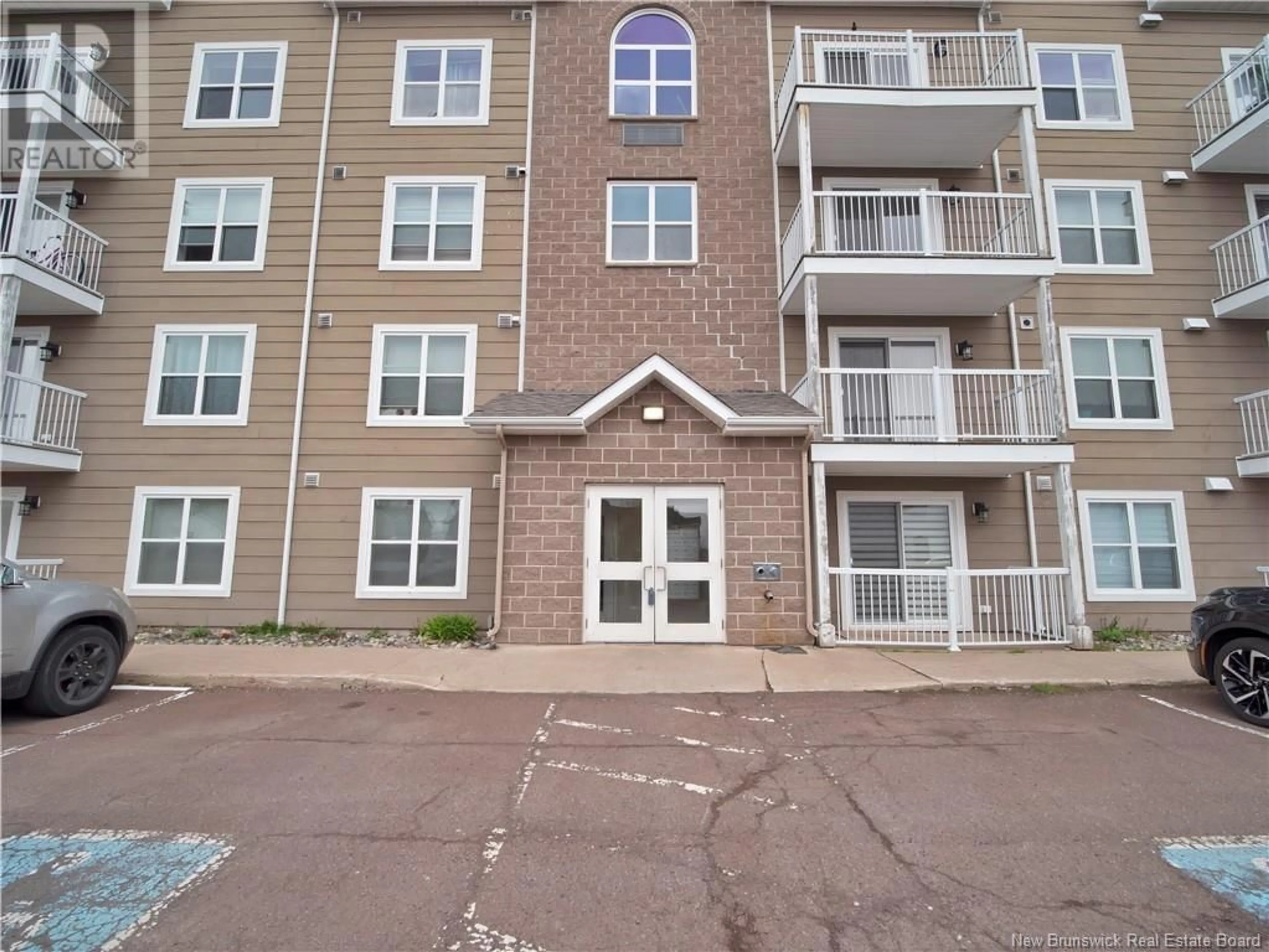 A pic from outside/outdoor area/front of a property/back of a property/a pic from drone, building for 305 - 33 SIFROI STREET, Dieppe New Brunswick E1A1L6