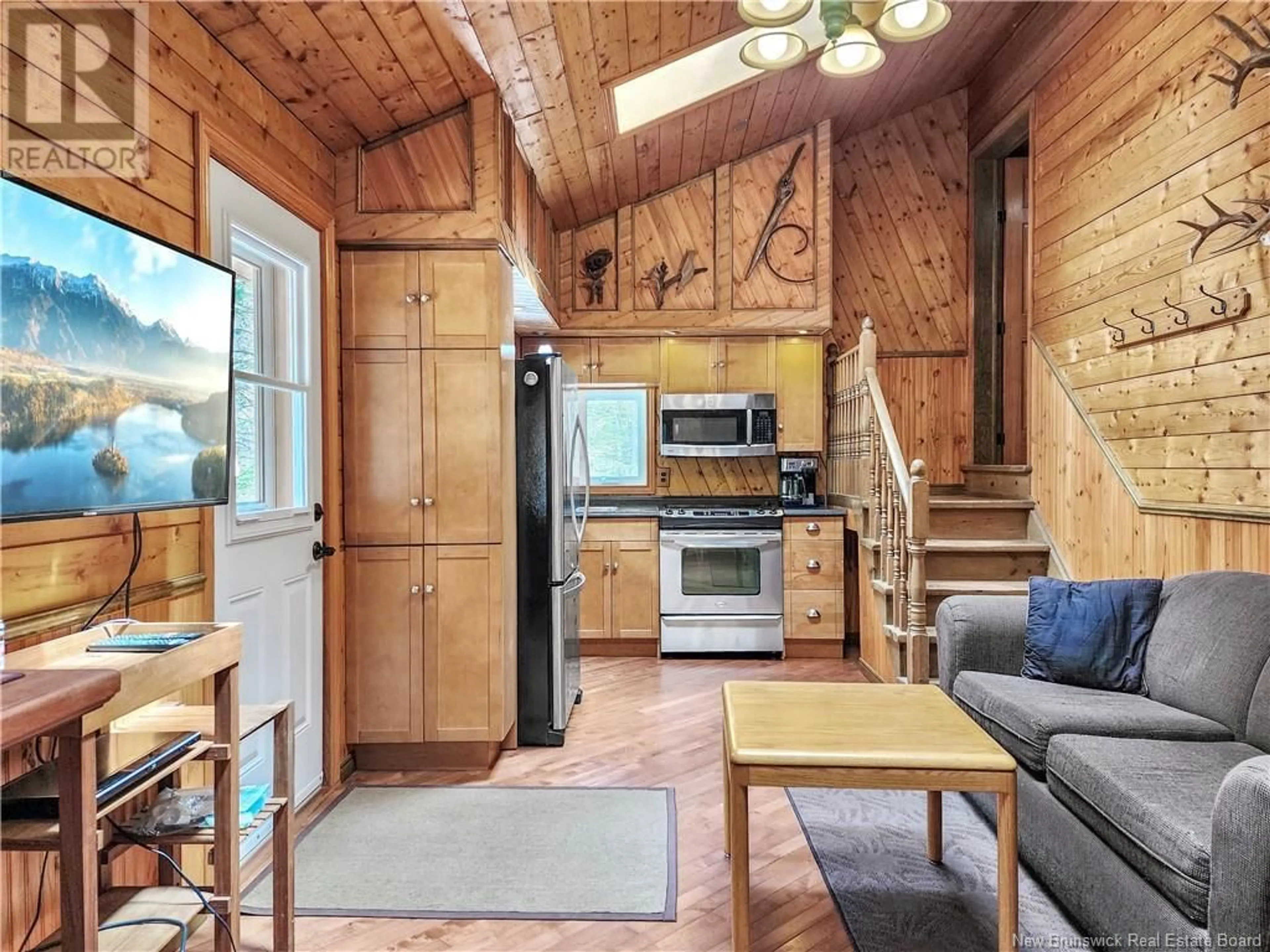Open concept kitchen, wood/laminate floor for 121 BIG SALMON RIVER ROAD, St. Martins New Brunswick E5R1J7