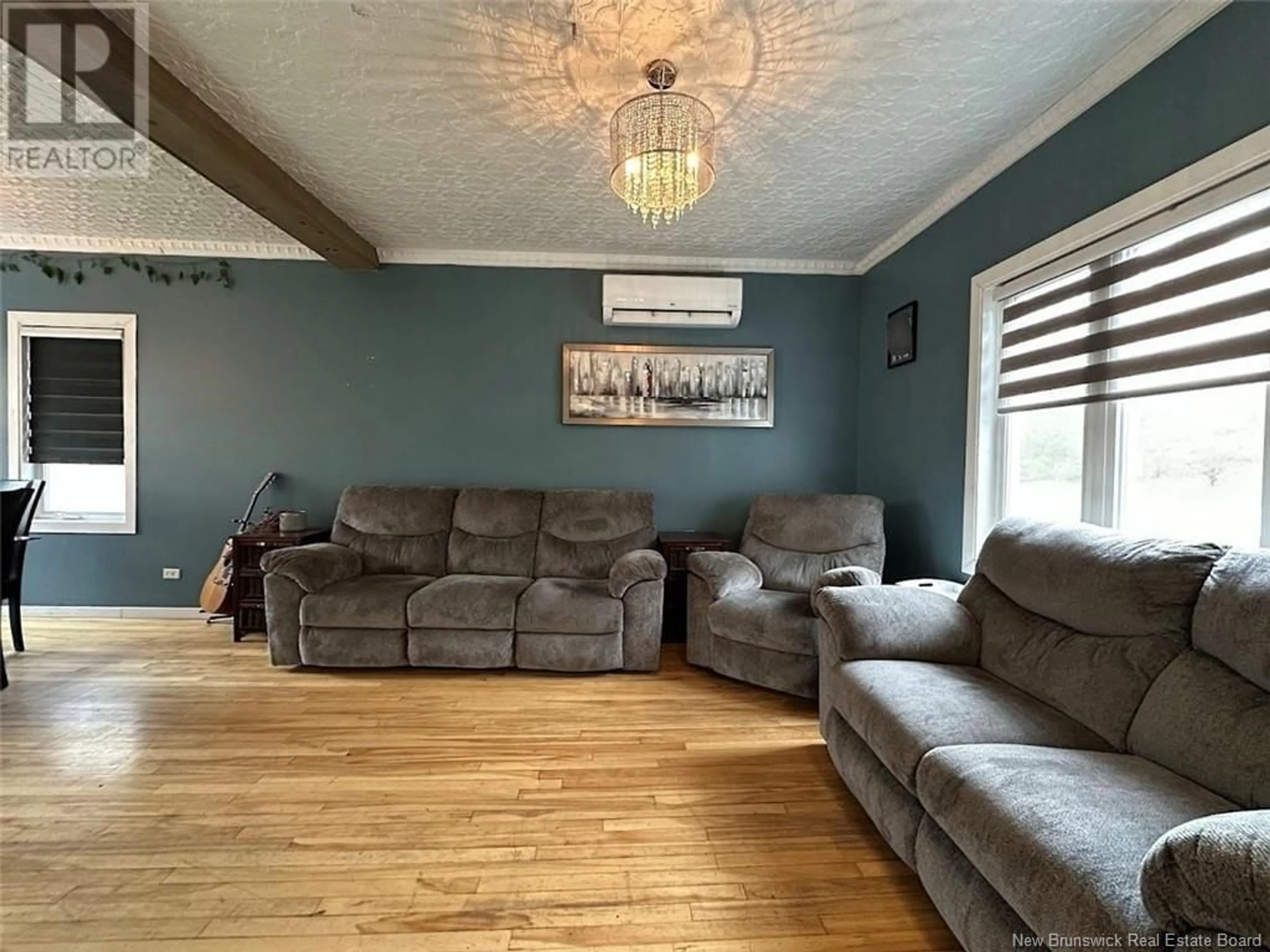 Living room with furniture, wood/laminate floor for 20 FORT AVENUE, Edmundston New Brunswick E3V1E1