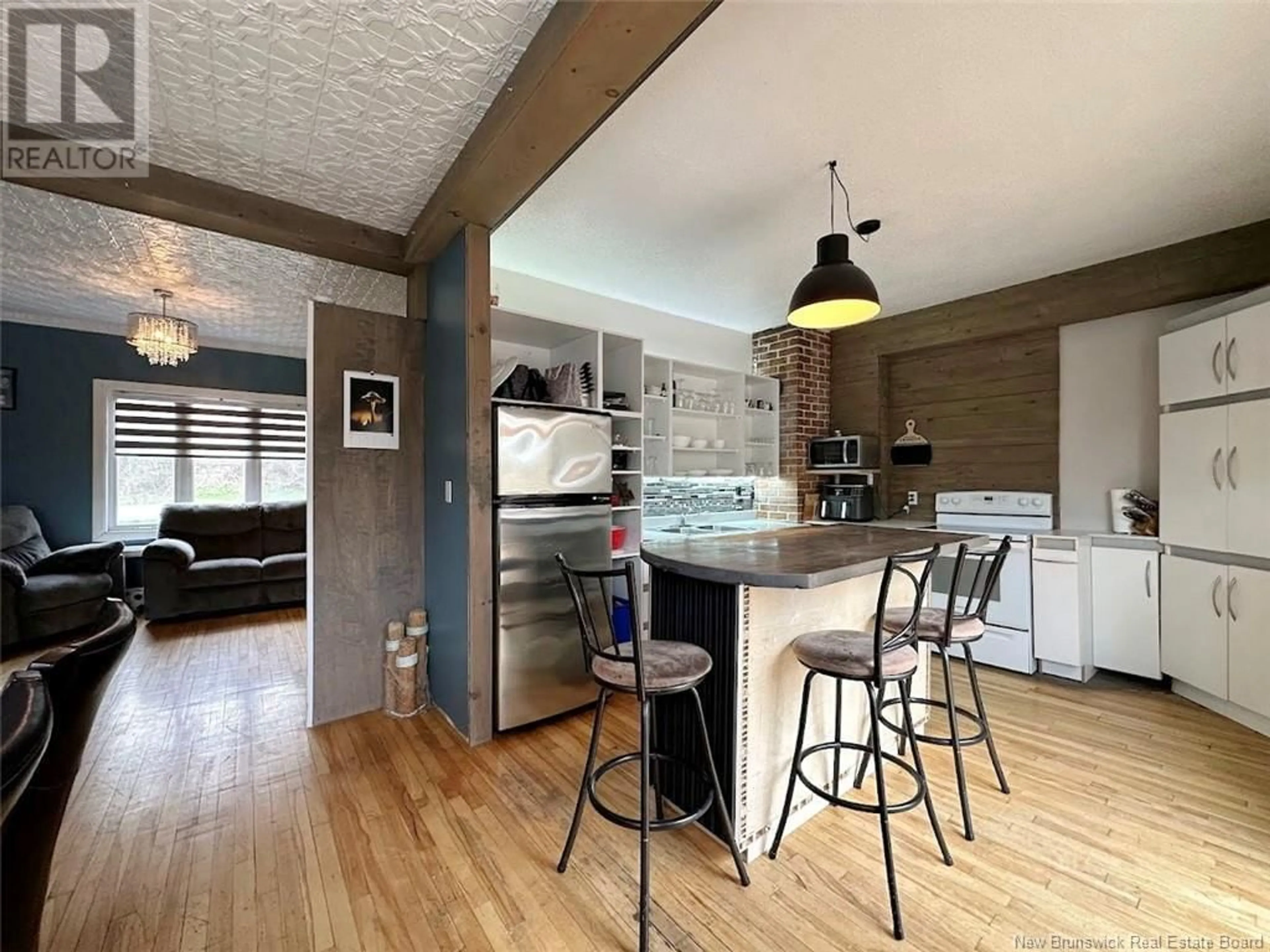 Open concept kitchen, wood/laminate floor for 20 FORT AVENUE, Edmundston New Brunswick E3V1E1