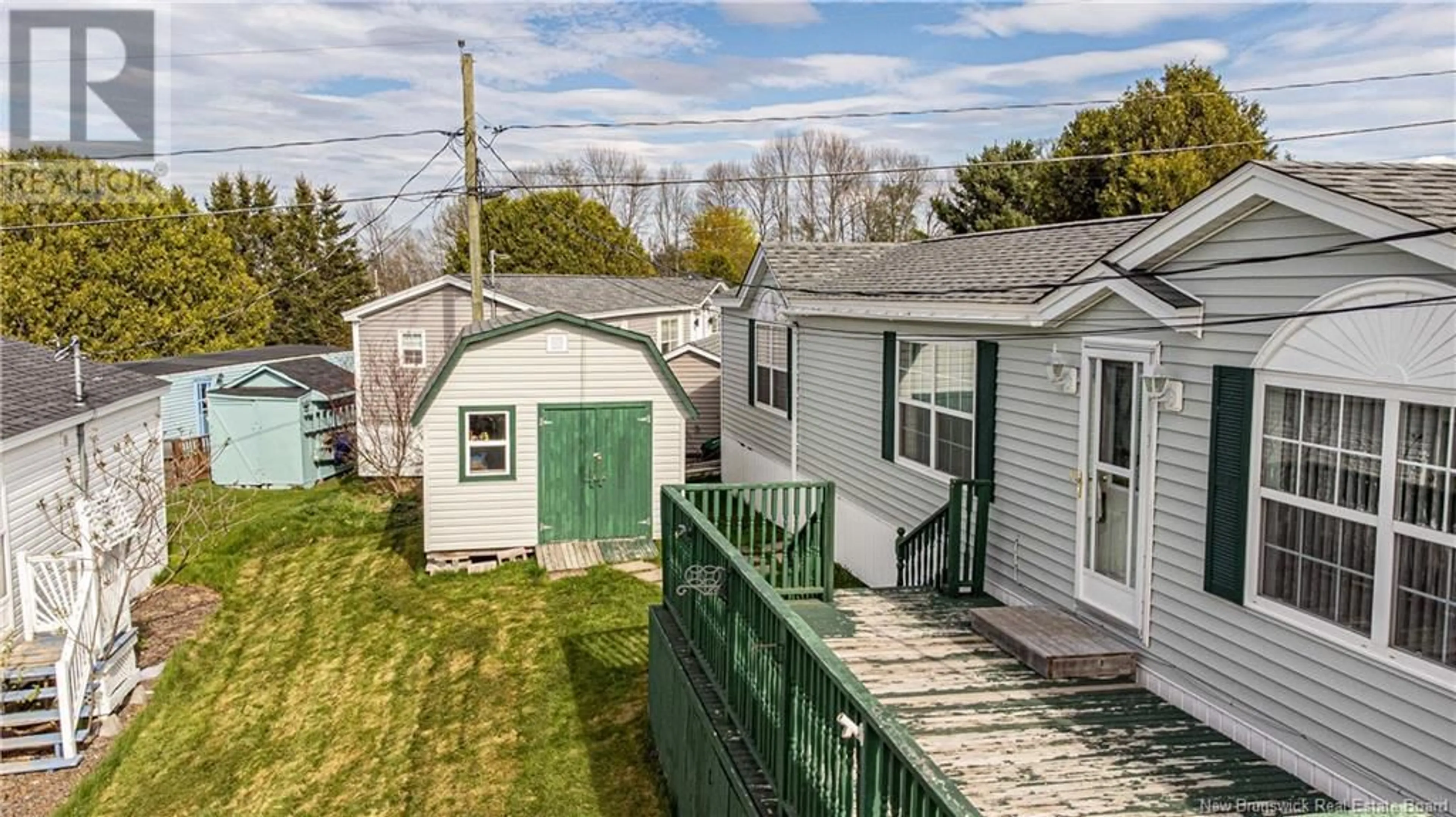 A pic from outside/outdoor area/front of a property/back of a property/a pic from drone, street for 20 SHERRY LANE, Fredericton New Brunswick E3C1L8