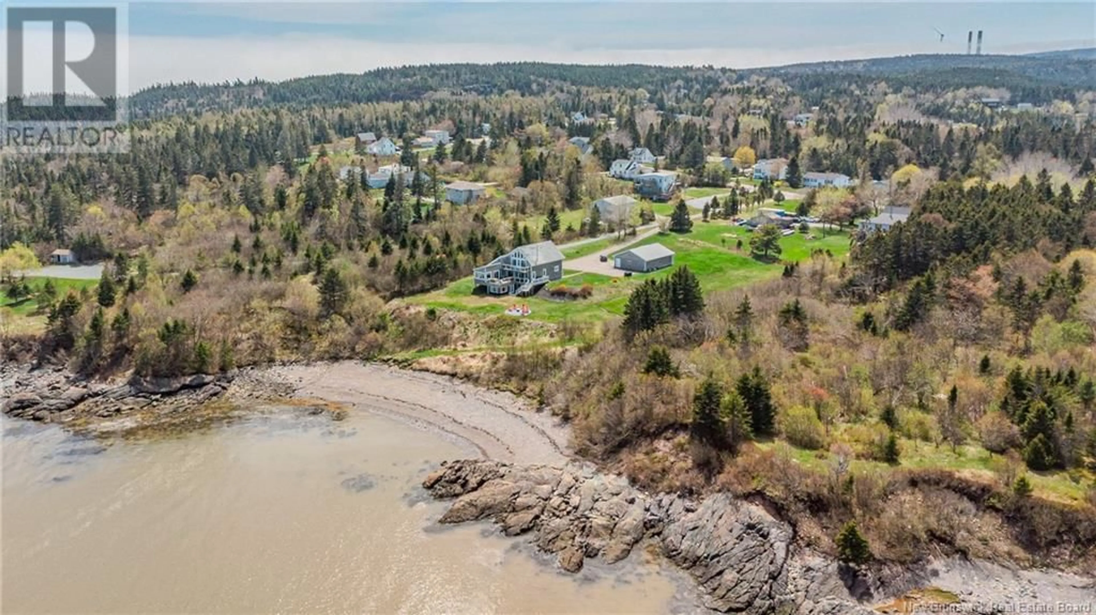 A pic from outside/outdoor area/front of a property/back of a property/a pic from drone, water/lake/river/ocean view for 396 POINT ROAD, Saint John New Brunswick E2M7J9