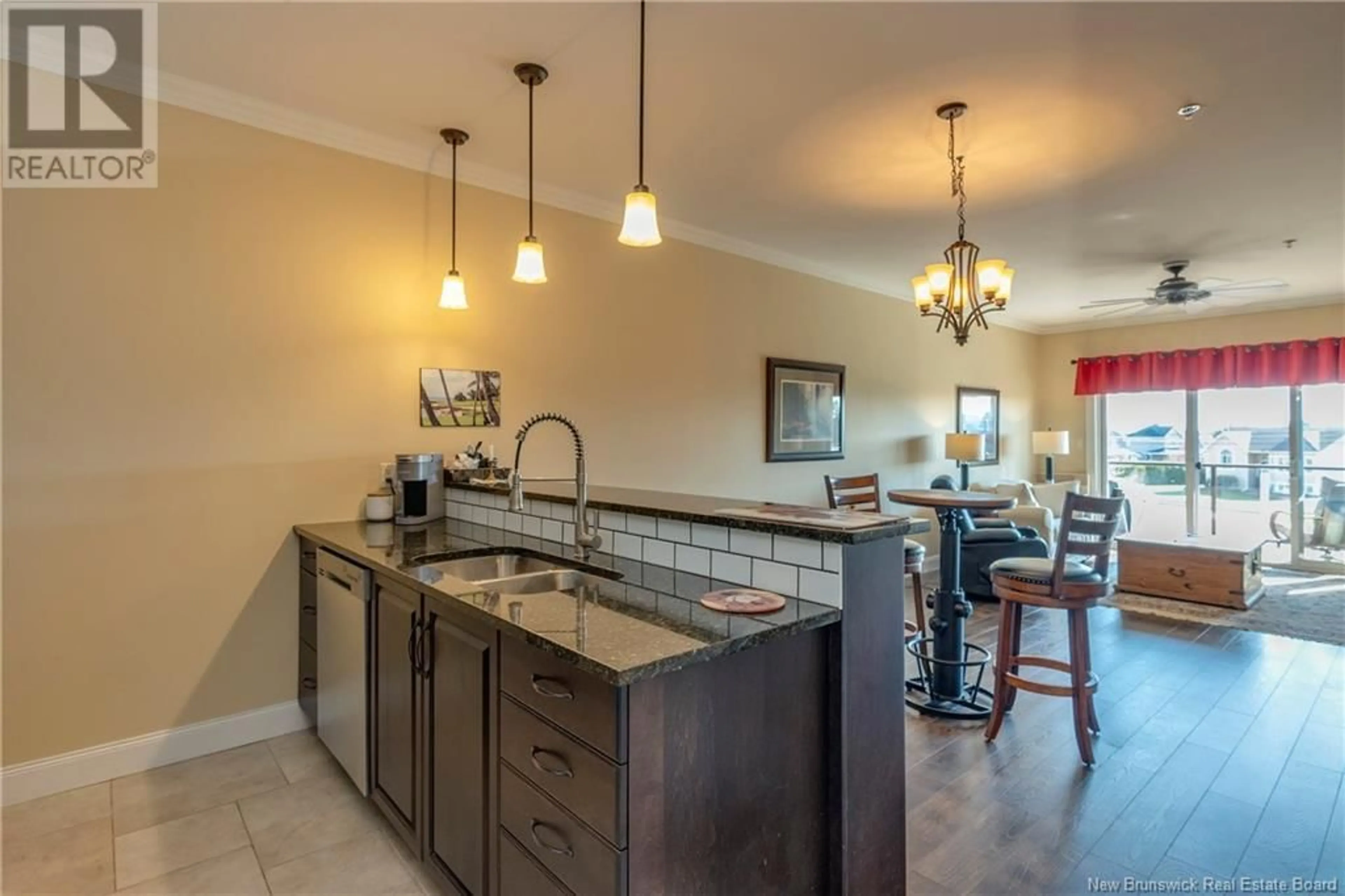 Open concept kitchen, ceramic/tile floor for 207 - 88 WOODS TERRACE, Moncton New Brunswick E1G1X6