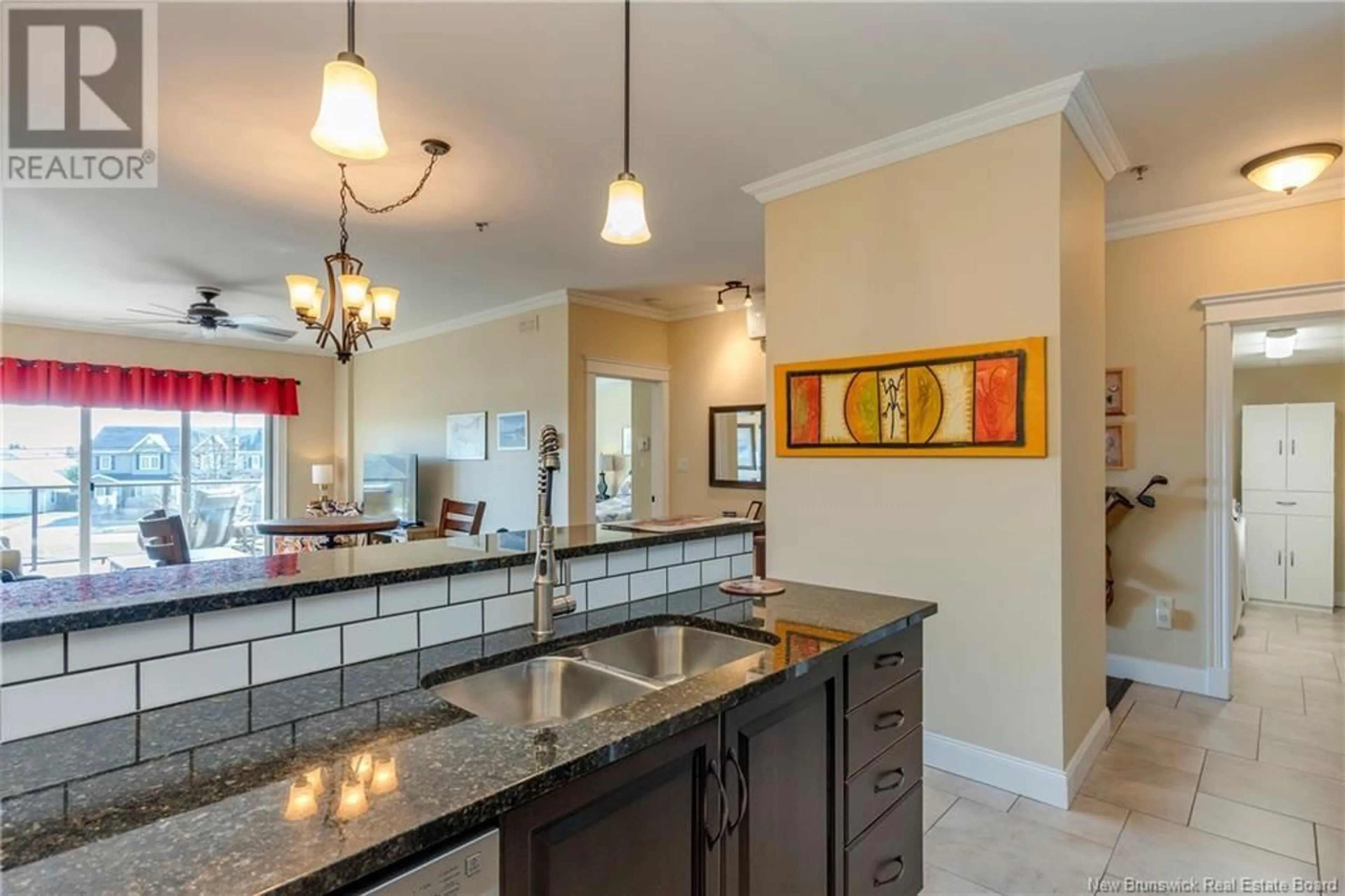 Open concept kitchen, ceramic/tile floor for 207 - 88 WOODS TERRACE, Moncton New Brunswick E1G1X6