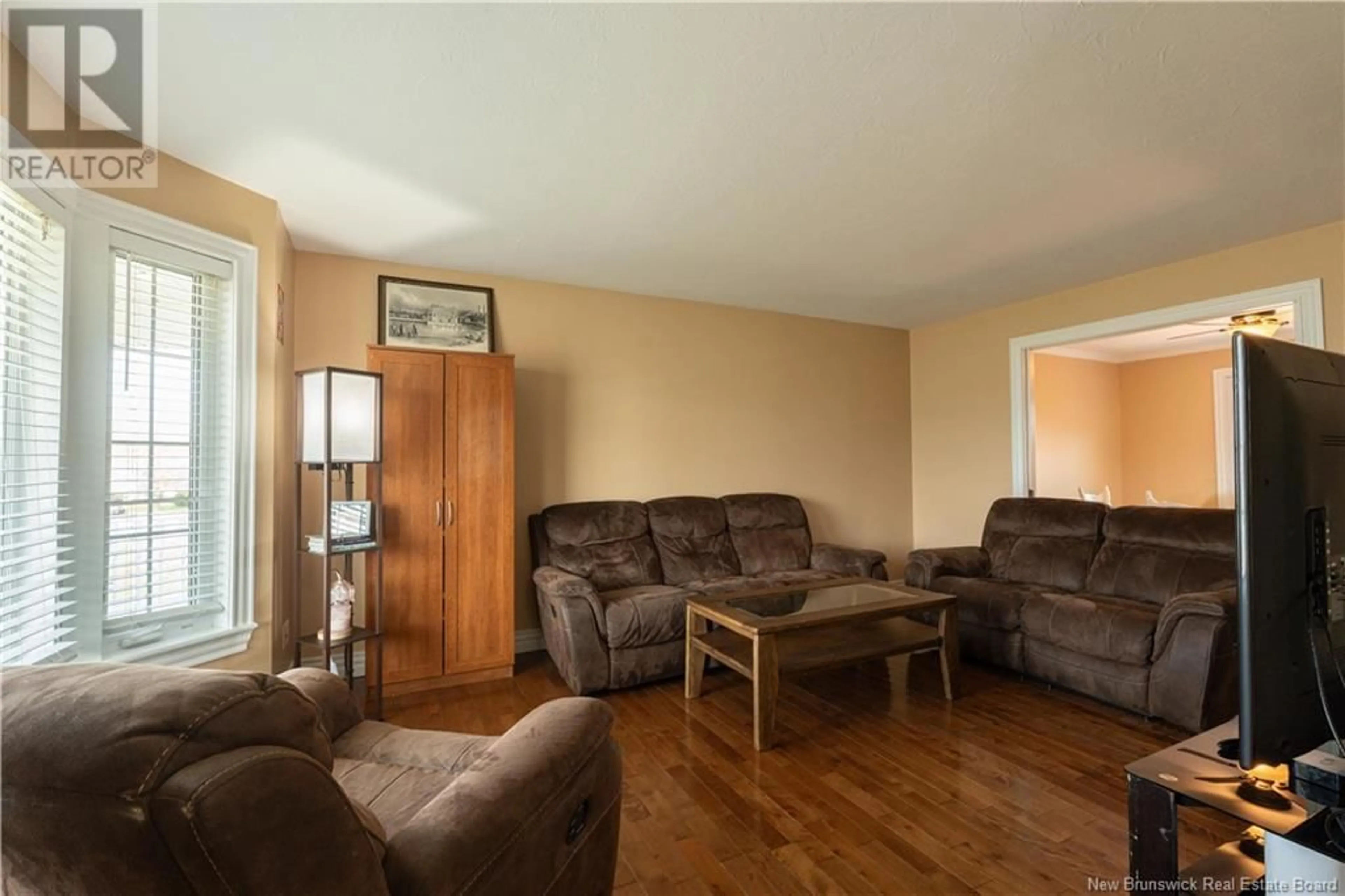 Living room with furniture, wood/laminate floor for 266 BULMAN DRIVE, Moncton New Brunswick E1G5P2