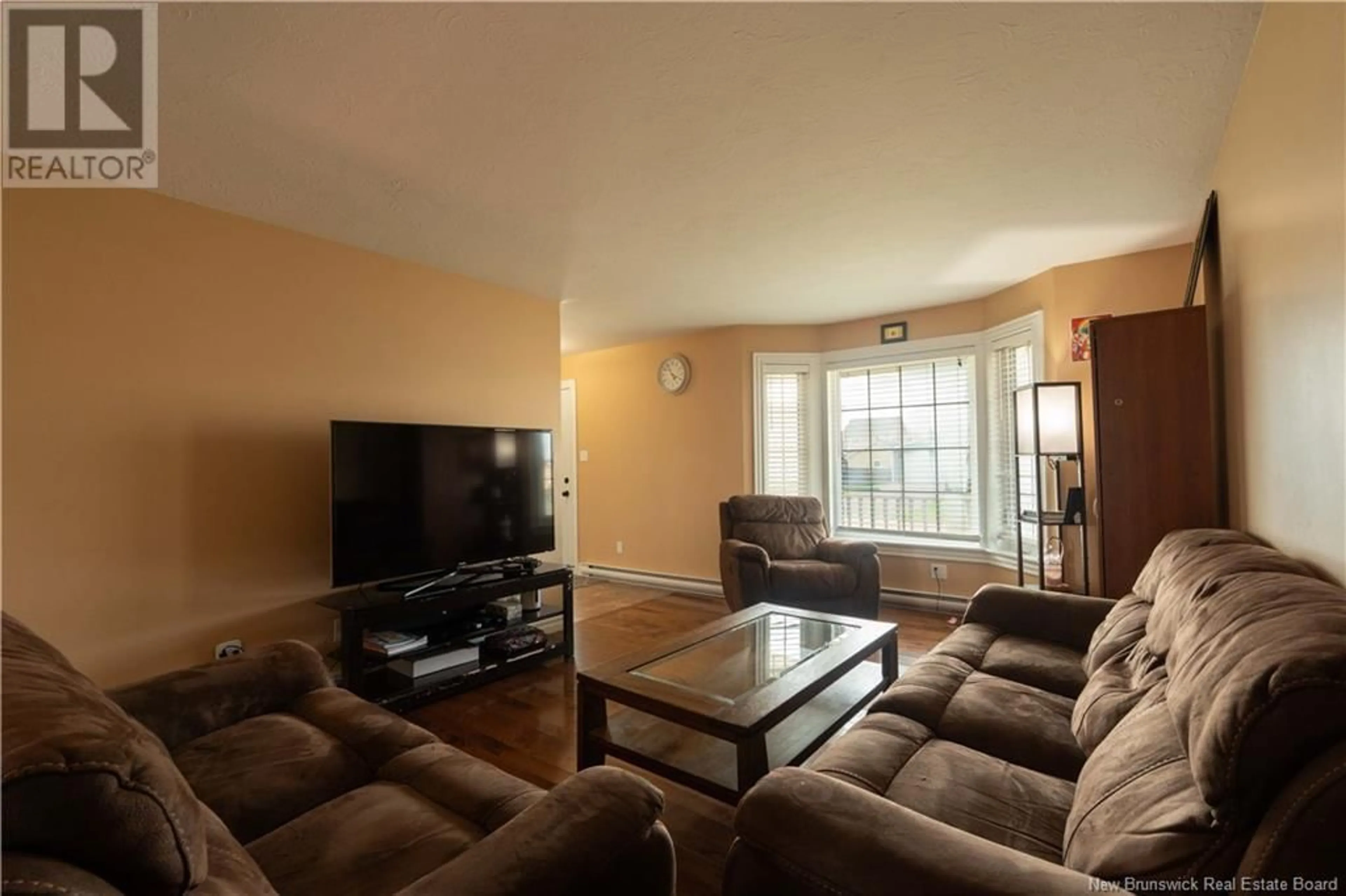 Living room with furniture, wood/laminate floor for 266 BULMAN DRIVE, Moncton New Brunswick E1G5P2