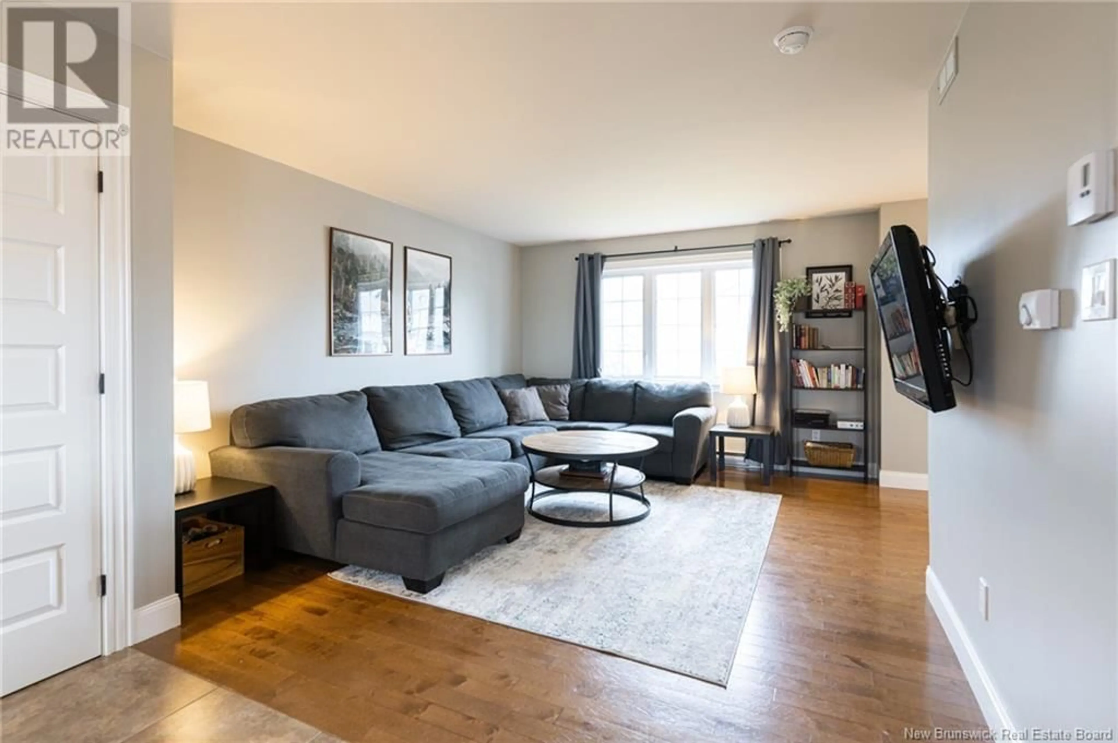 Living room with furniture, wood/laminate floor for 11 LANCEFIELD CRESCENT, Moncton New Brunswick E1E0E7