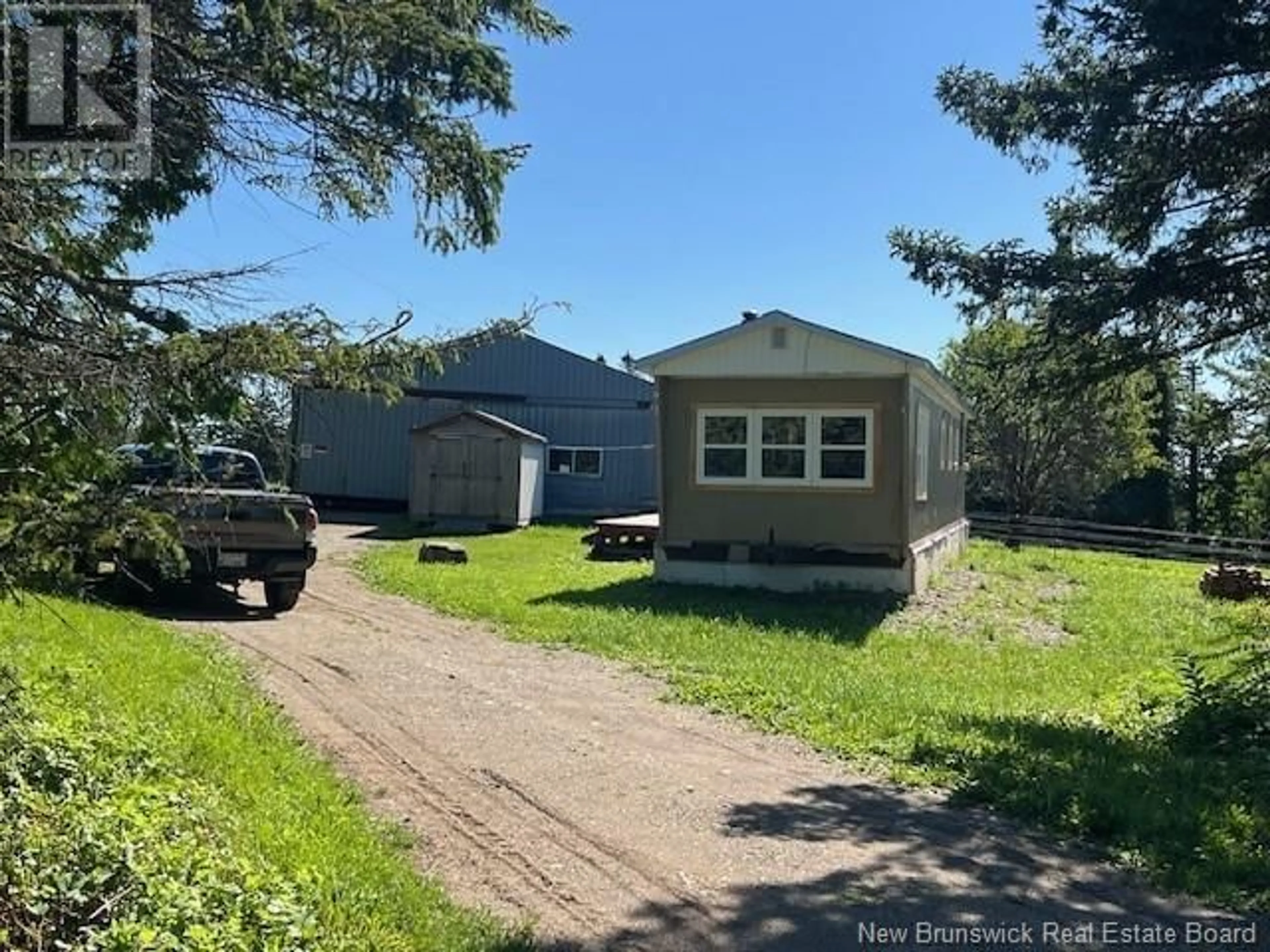 A pic from outside/outdoor area/front of a property/back of a property/a pic from drone, street for 3864 ROUTE 620, Tay Creek New Brunswick E3B1K1