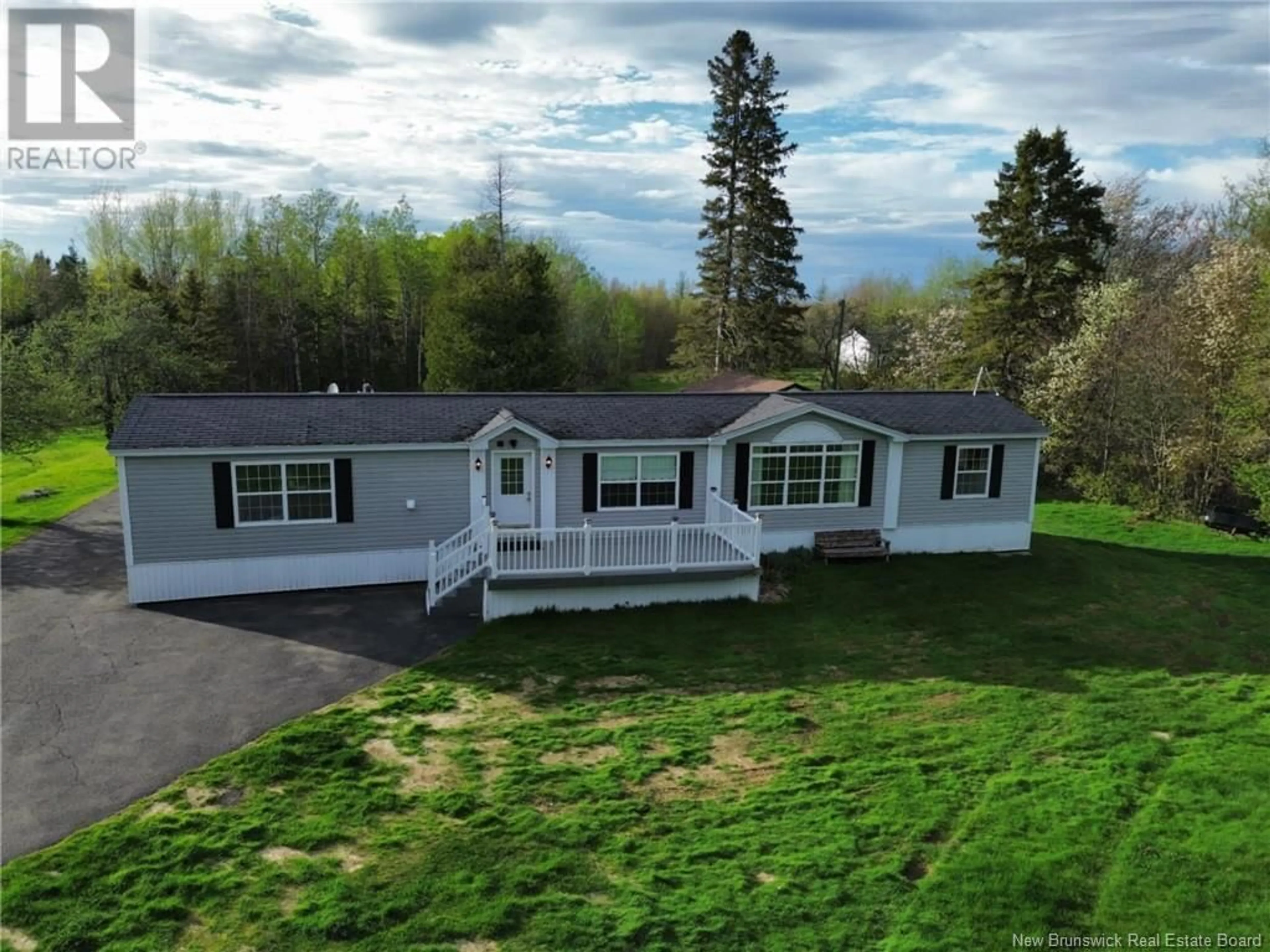 A pic from outside/outdoor area/front of a property/back of a property/a pic from drone, unknown for 19 COX POINT ROAD, Cumberland Bay New Brunswick E4A2X1