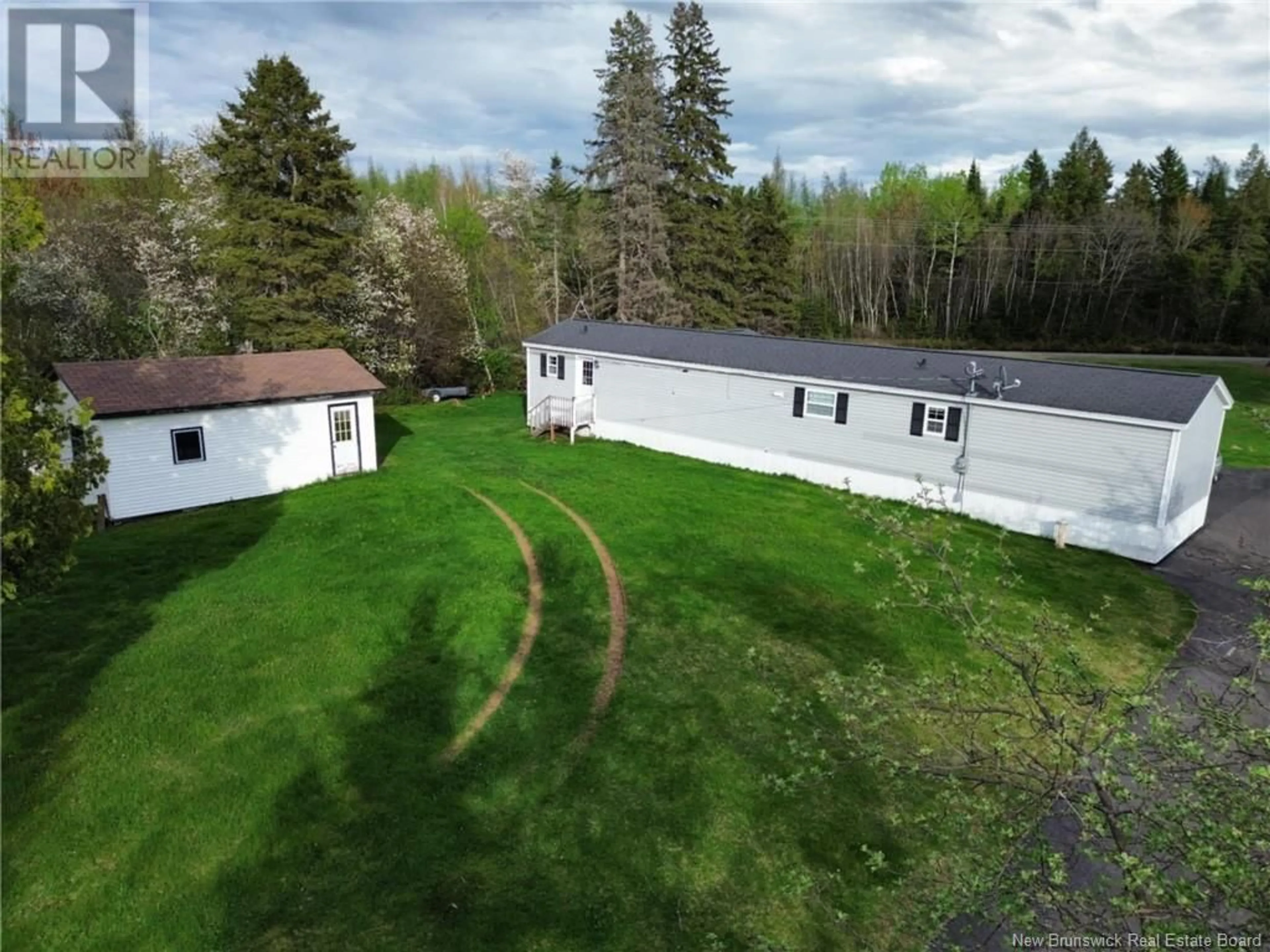 A pic from outside/outdoor area/front of a property/back of a property/a pic from drone, unknown for 19 COX POINT ROAD, Cumberland Bay New Brunswick E4A2X1